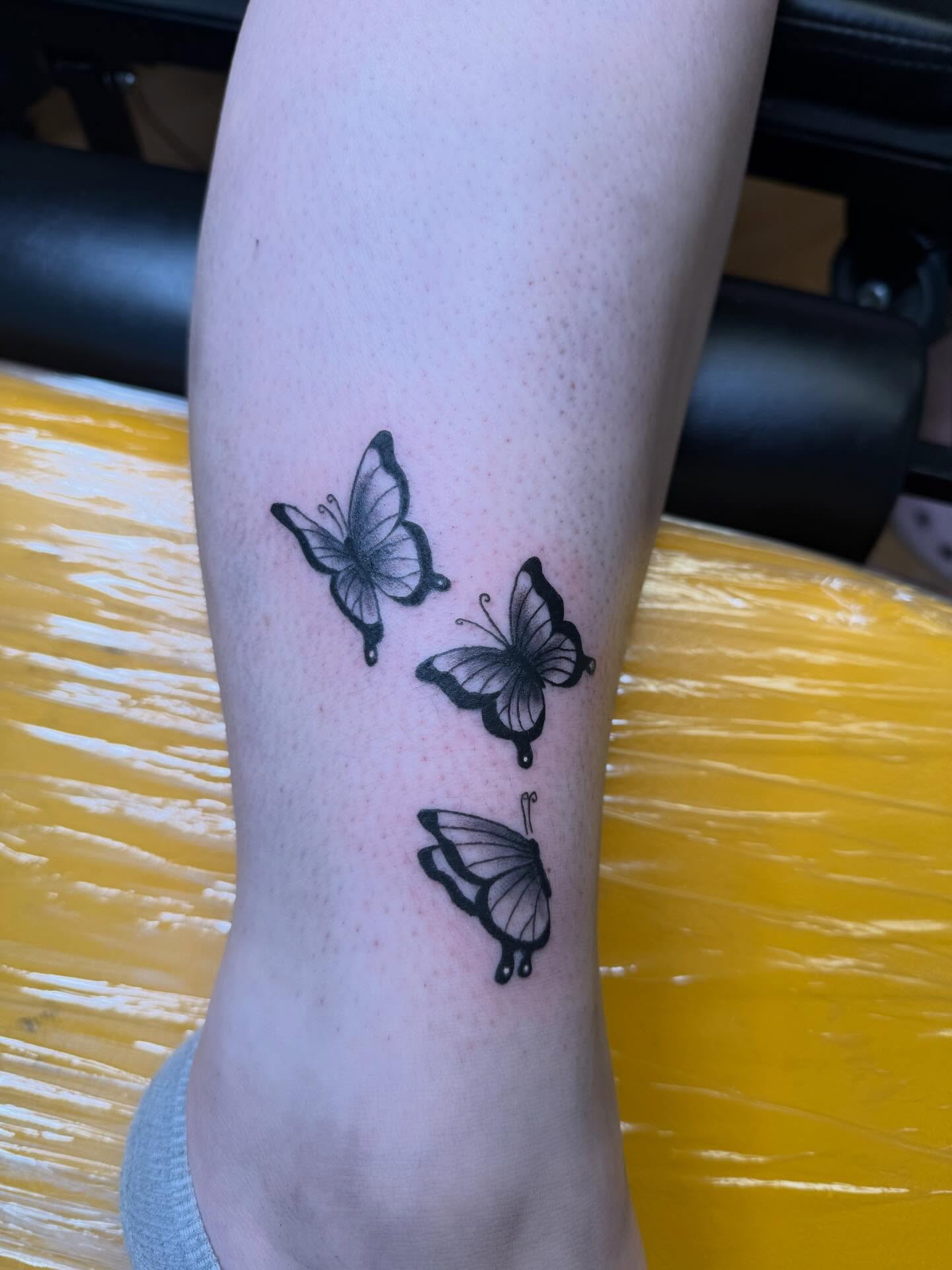 Butterflies black and grey tattoo on the forearm by Liz🗡️Fort Collins🗡️Tattoo Apprentice