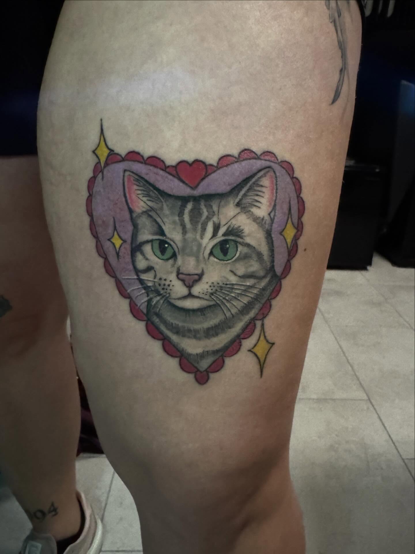 Cat realism tattoo on the thigh by Lindsay