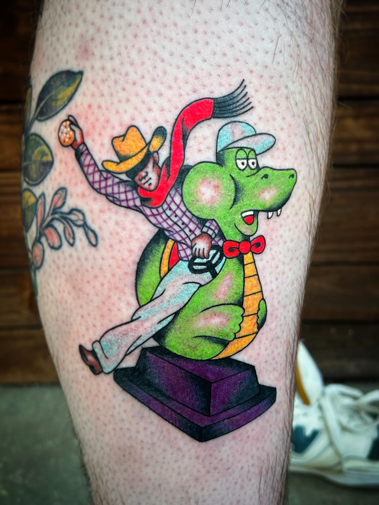 Crocodile and cowboy American traditional tattoo on the thigh by Kayla Shoffner
