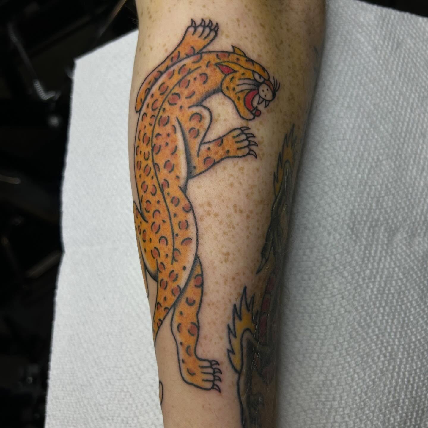 Cheetah American traditional tattoo on the forearm by Bregan ✨