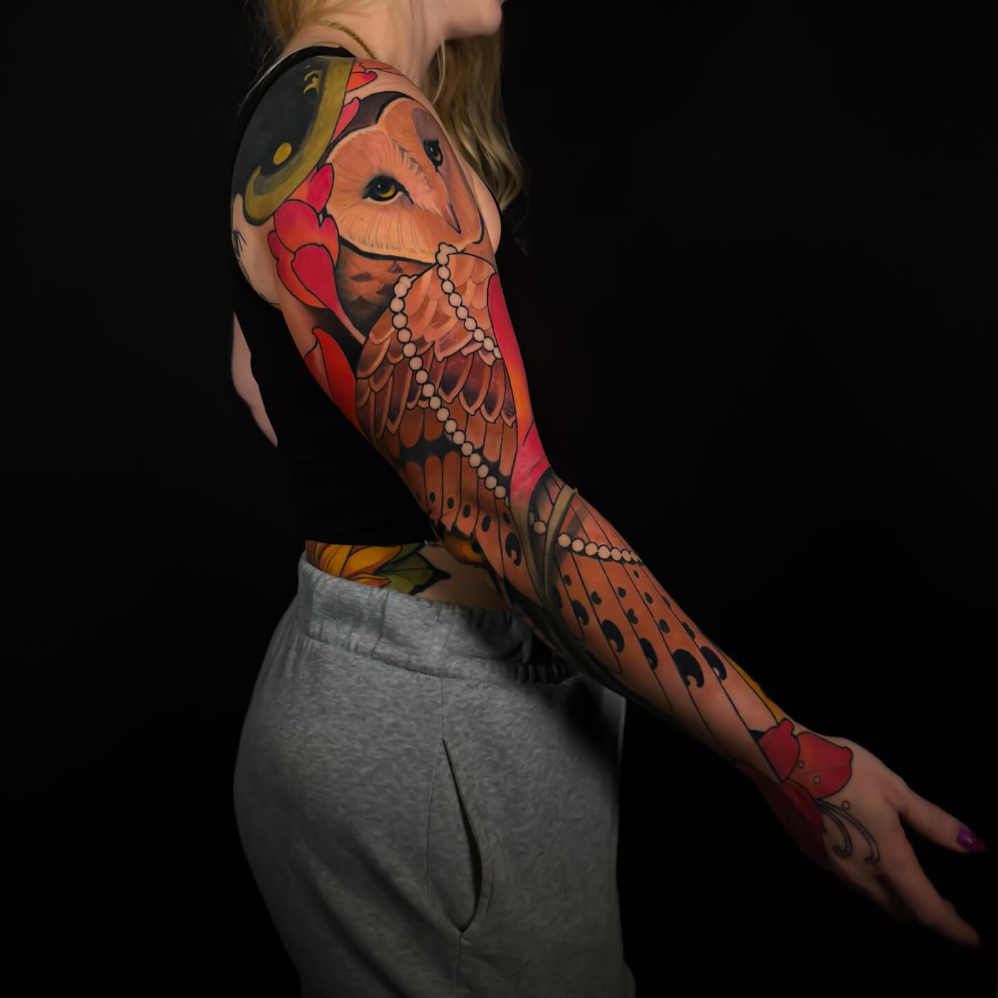 Owl and butterfly American traditional tattoo on the upper arm by Carlos Valdes ✨ Tattoo Artist in Tampa FL