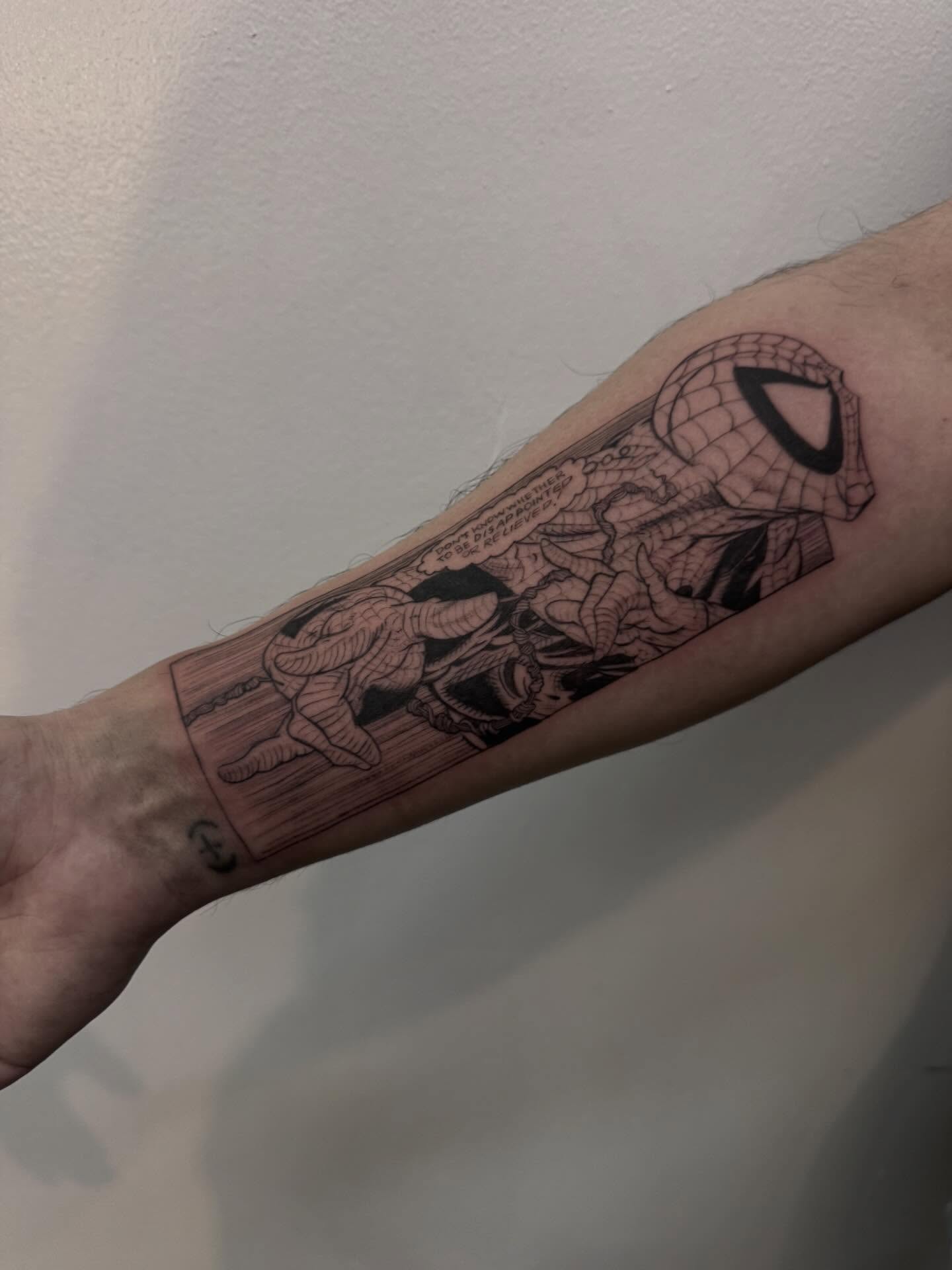 Spider-man black and grey tattoo on the forearm by Tianna Osborne