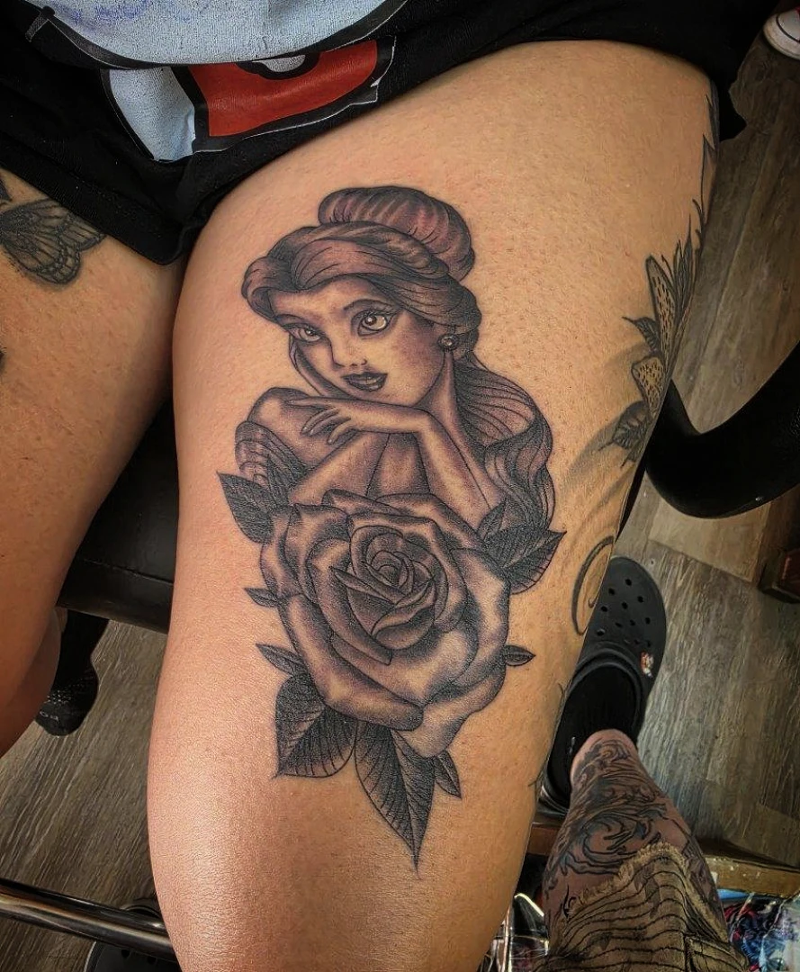 Woman with roses realism tattoo on the thigh by Josh Sroga