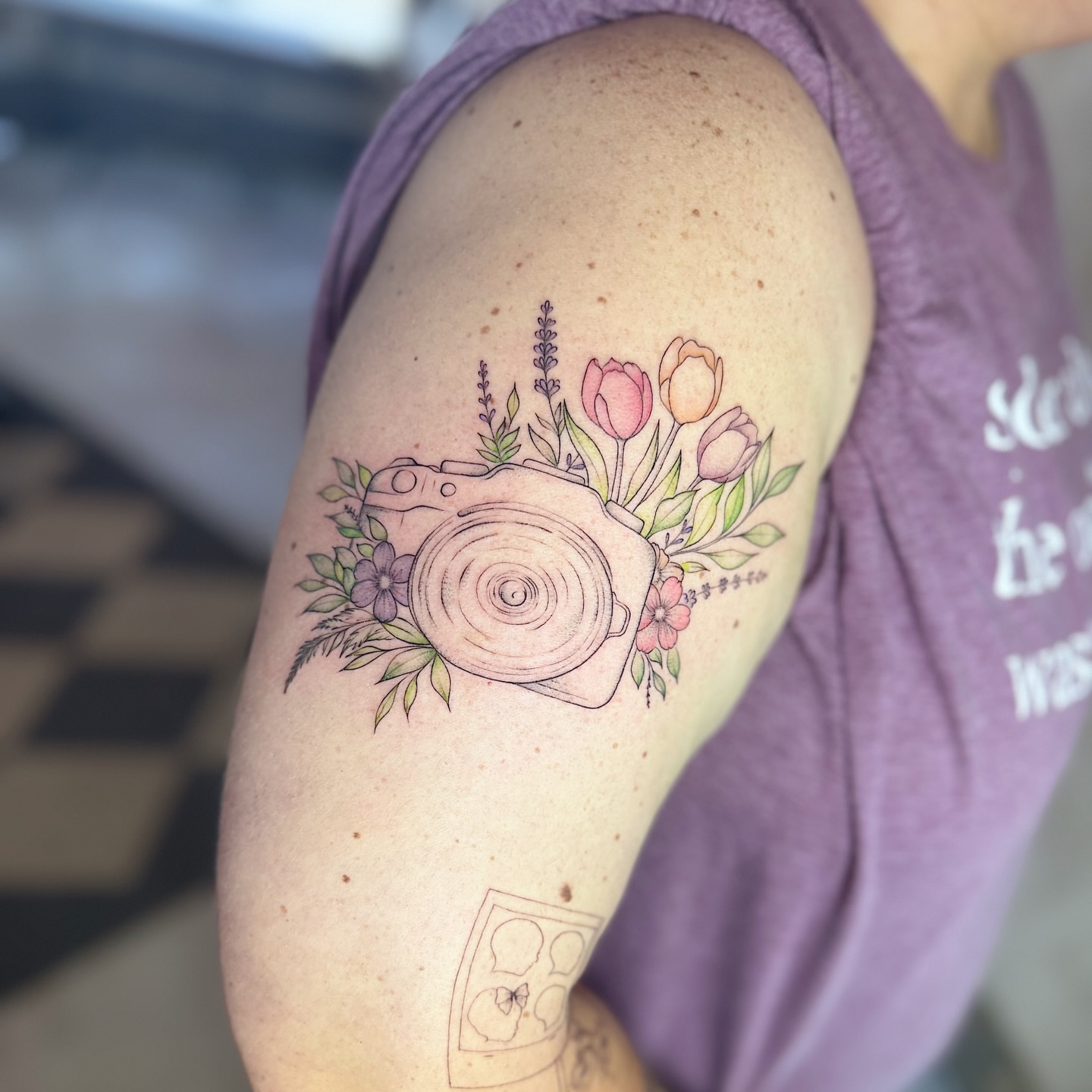 Camera with flowers new school tattoo on the shoulder by INK with Christian, Mineral Wells, Texas