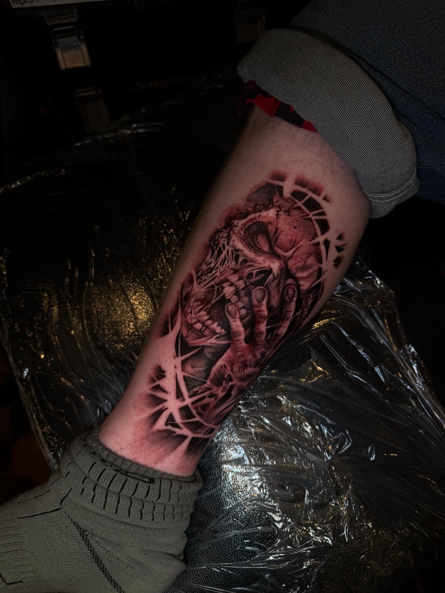 Human skull dark realism tattoo on the forearm by Smuk One