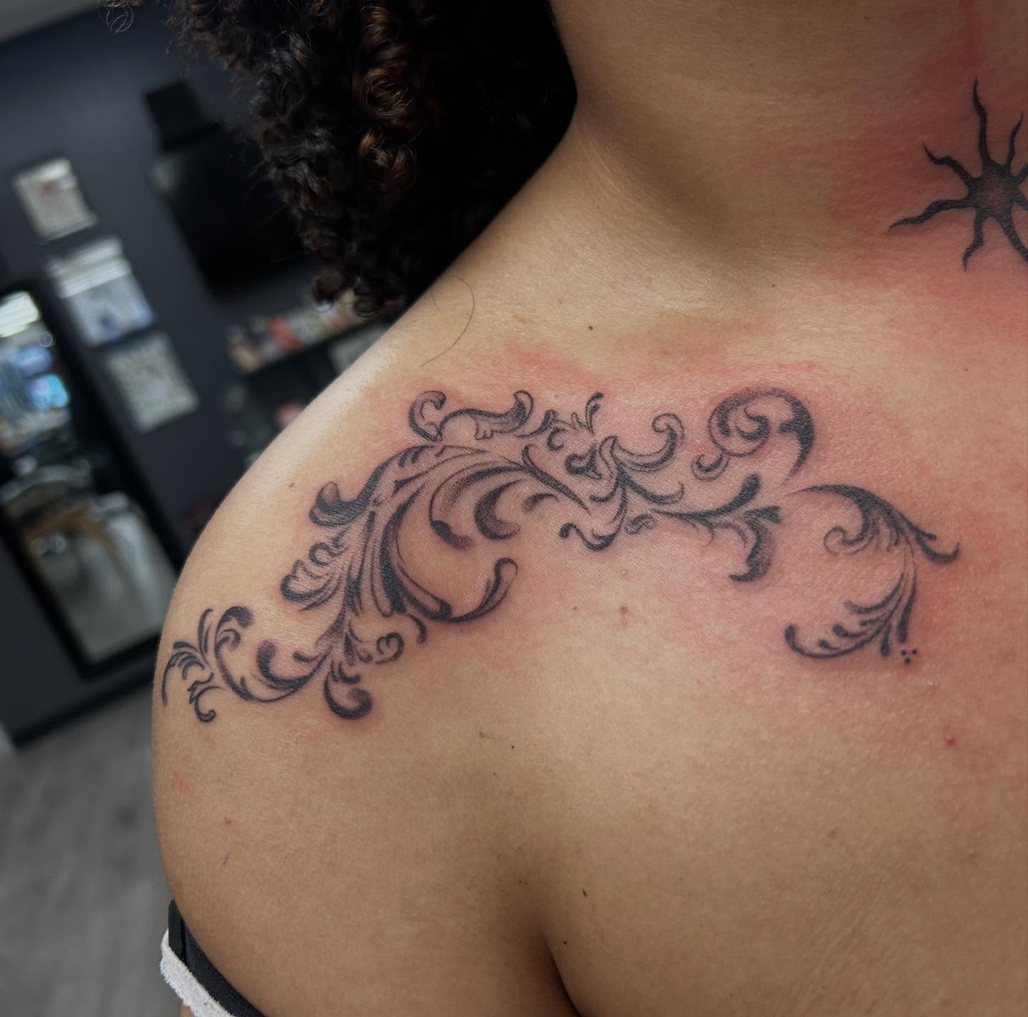 Scrollwork ornamental tattoo on the shoulder by Livy baby