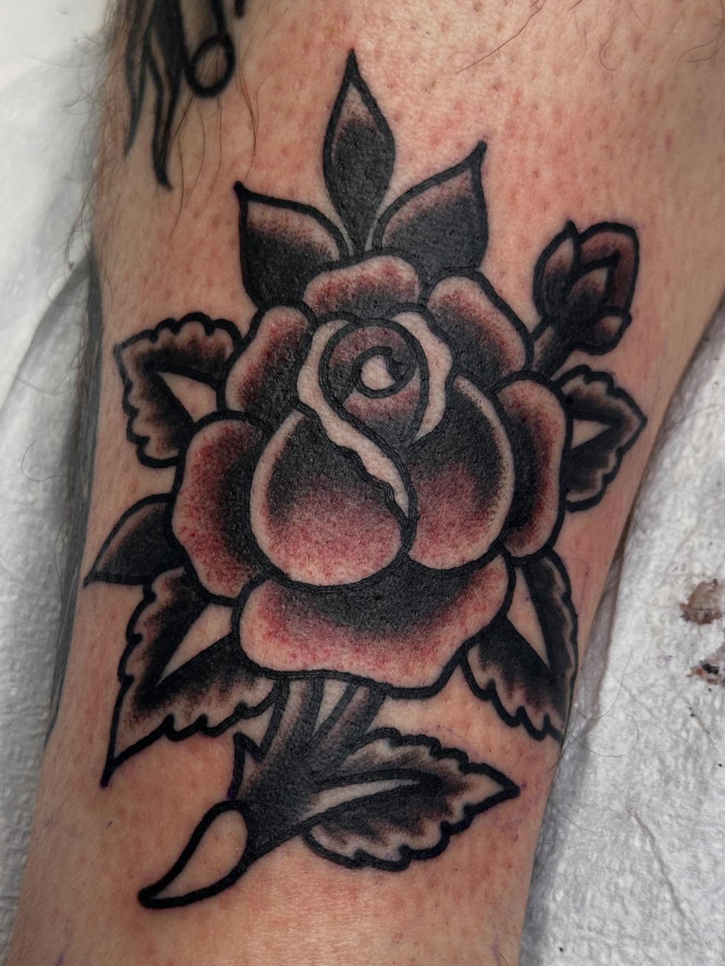 Rose American traditional tattoo on the forearm by Cody Woolard, Seymour, Tennessee