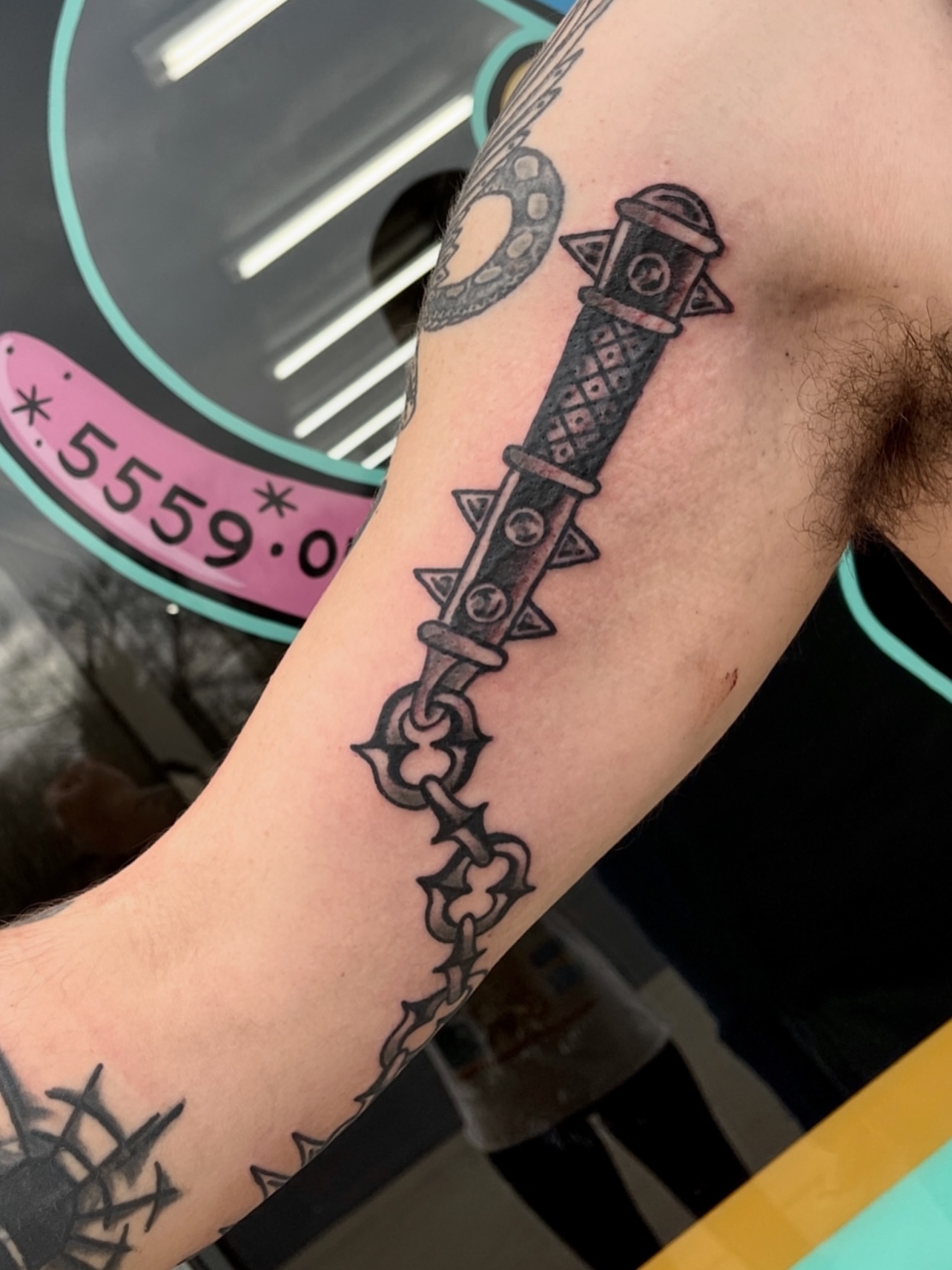 Knife and chain black and grey tattoo on the forearm by Patrick Miller, Huber Heights, Ohio