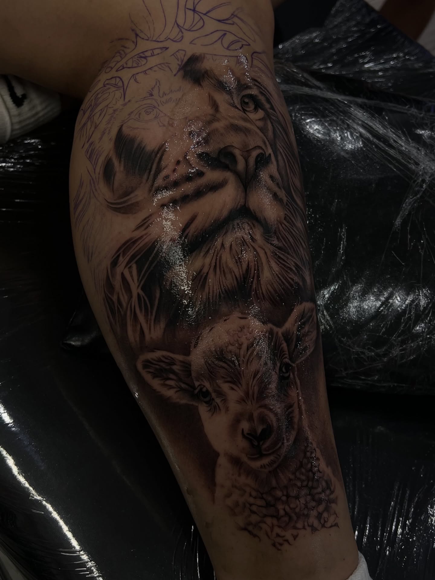 Lion and lamb realism tattoo on the forearm by Espi