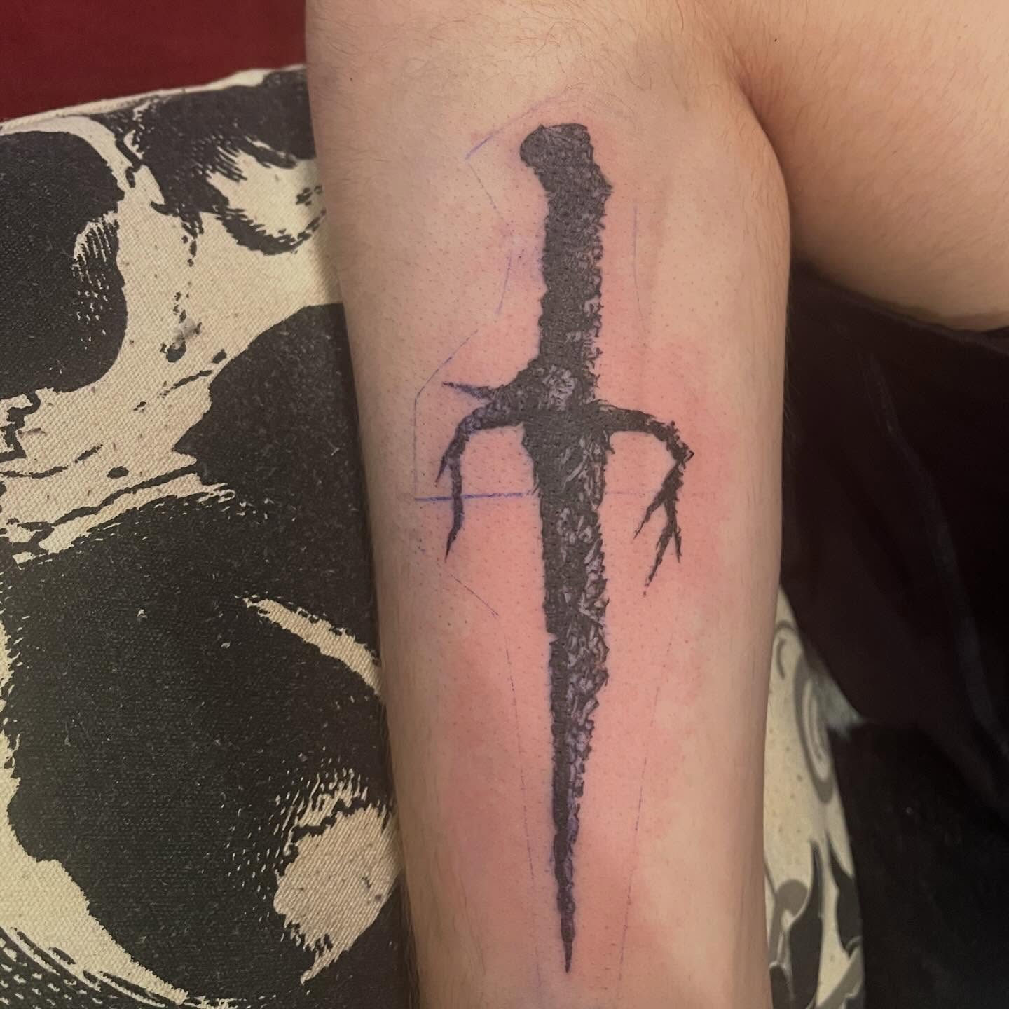 Sword black and grey tattoo on the forearm by ren