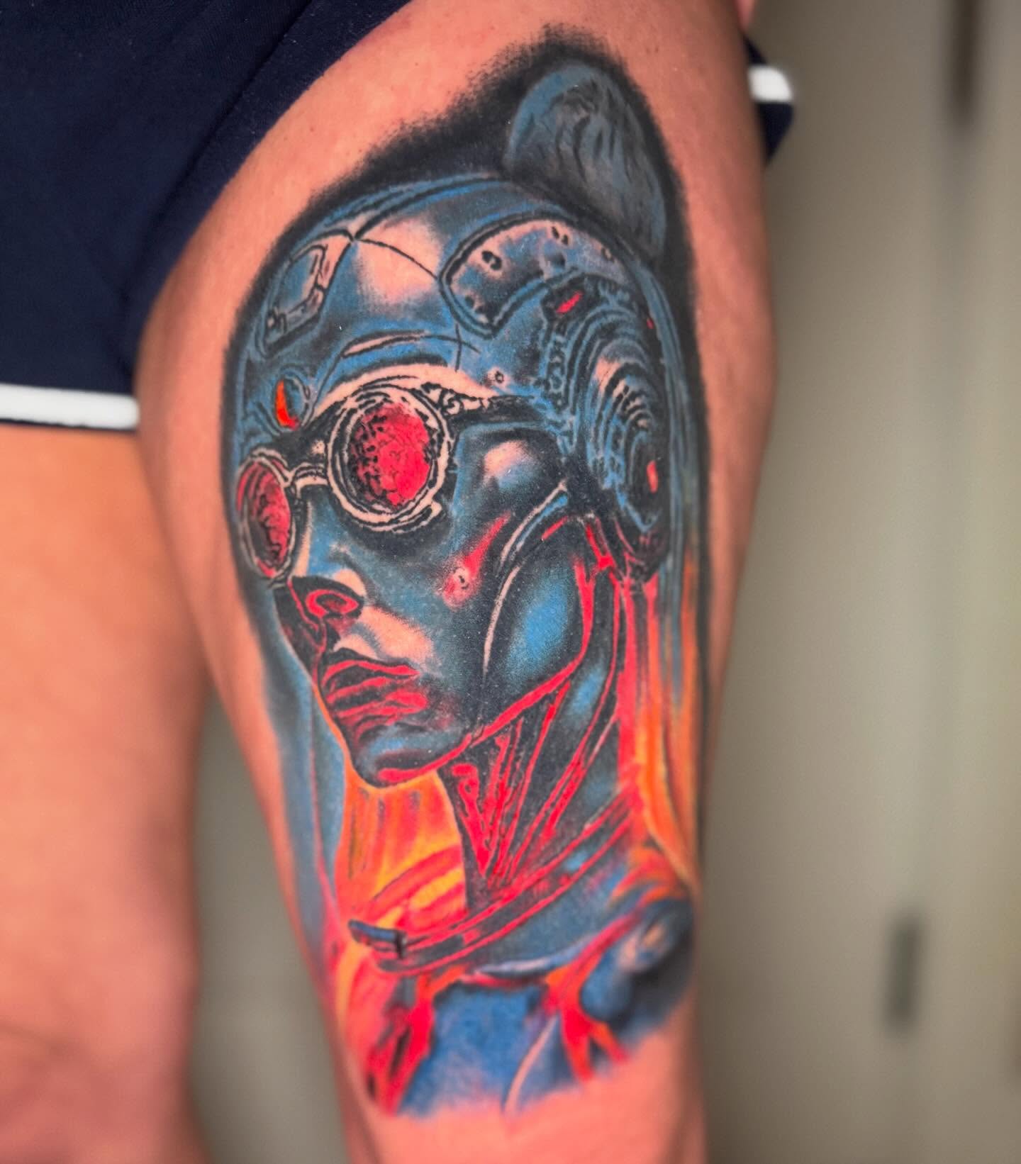 Cyborg face dark realism tattoo on the thigh by spikecitytattoo