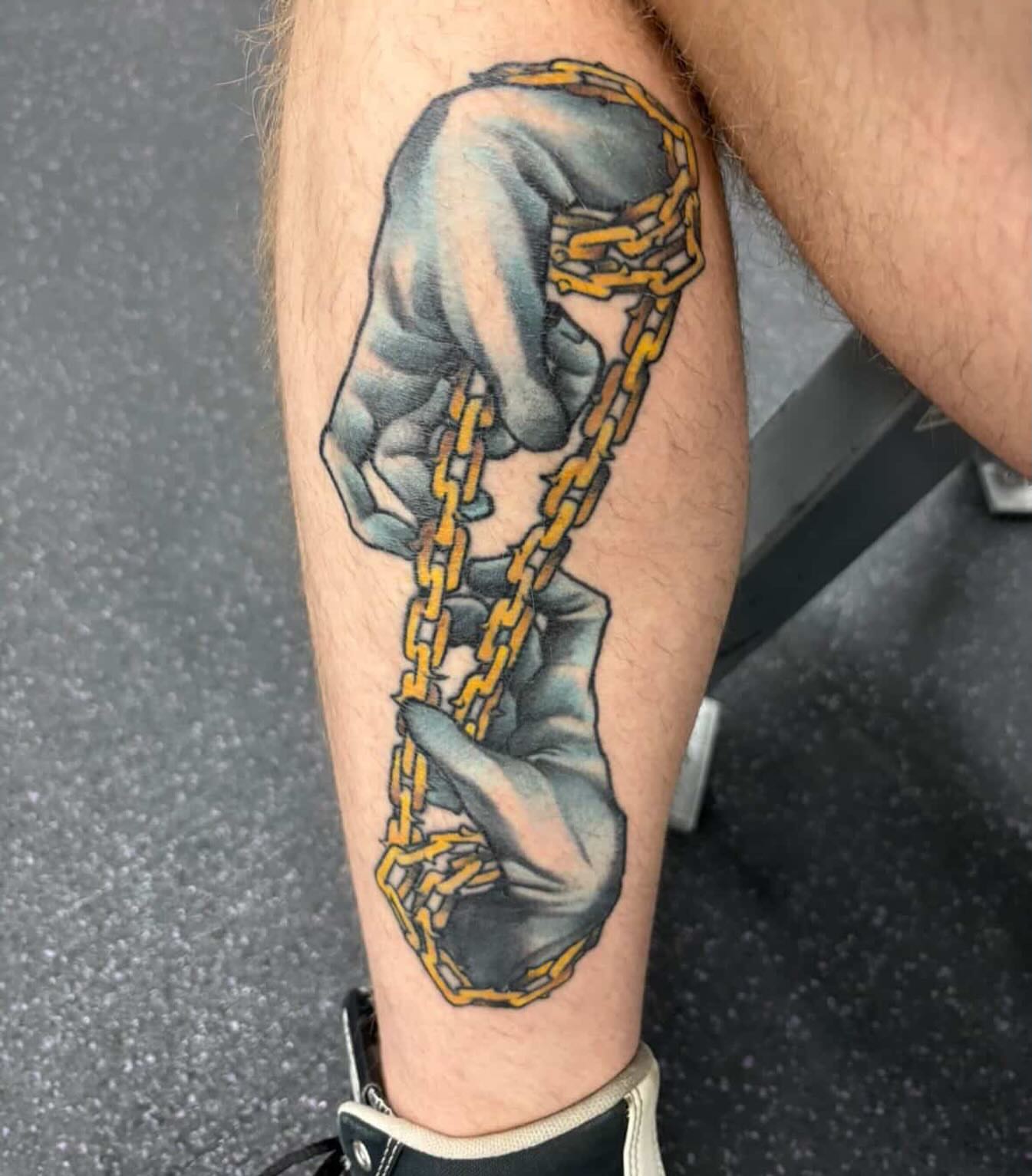 Hands and chain realism tattoo on the calf by Mike Bean, Minneapolis, Minnesota