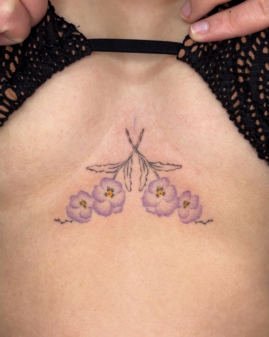 Purple flowers dotwork tattoo on the chest by mia