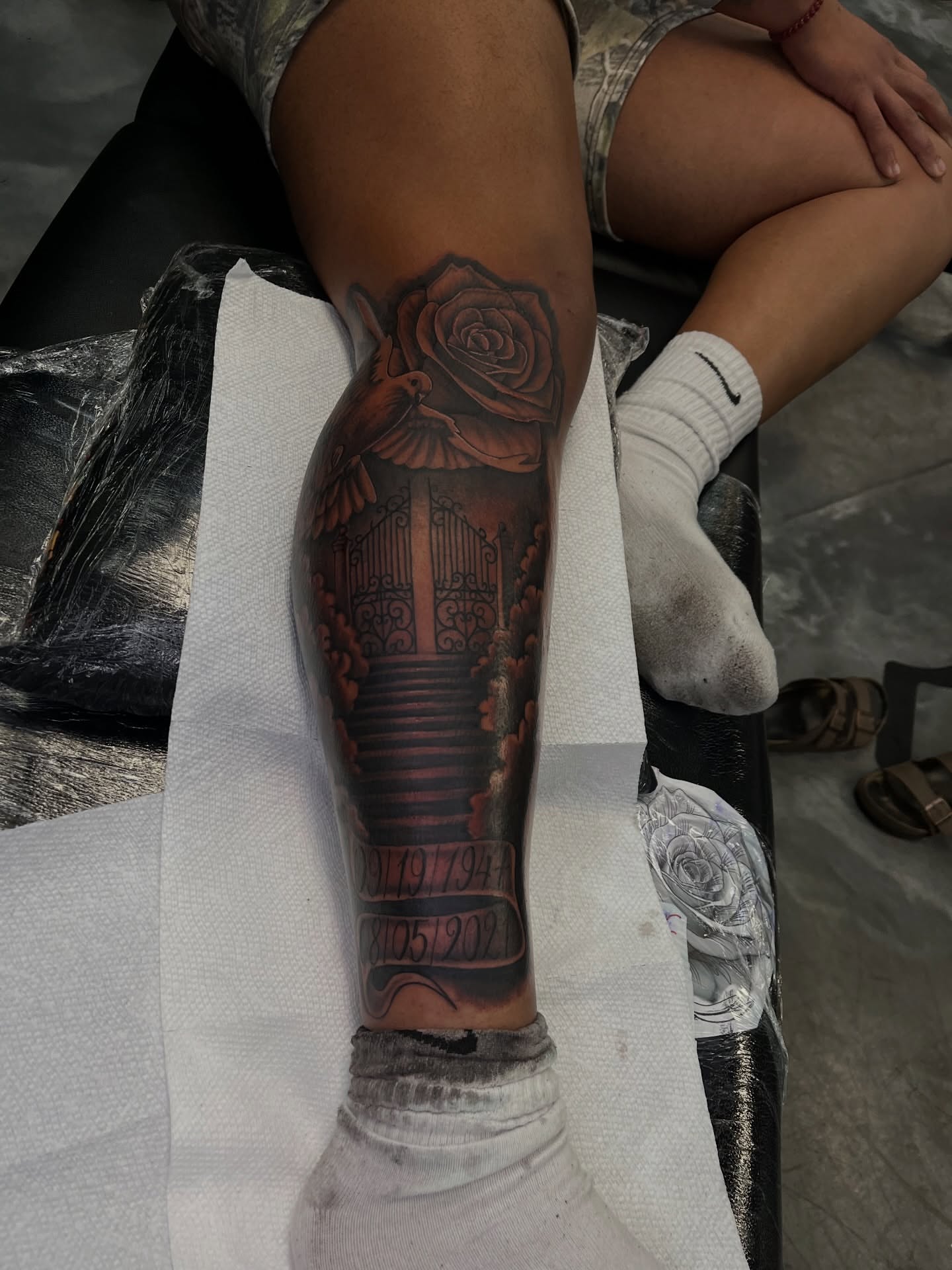 Rose and gate realism tattoo on the calf by Dee