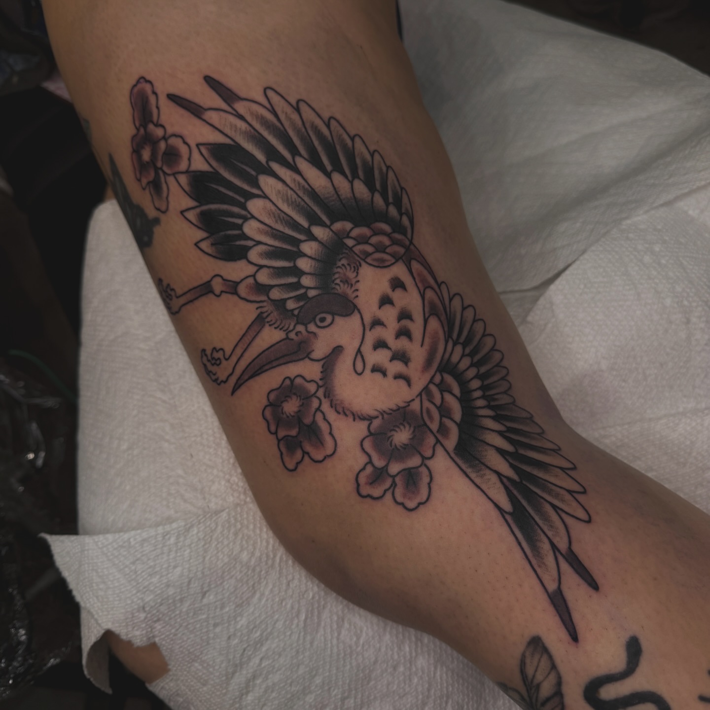 Bird and flowers black and grey tattoo on the forearm by Liz Mercer ★ Tattooer - Raleigh NC