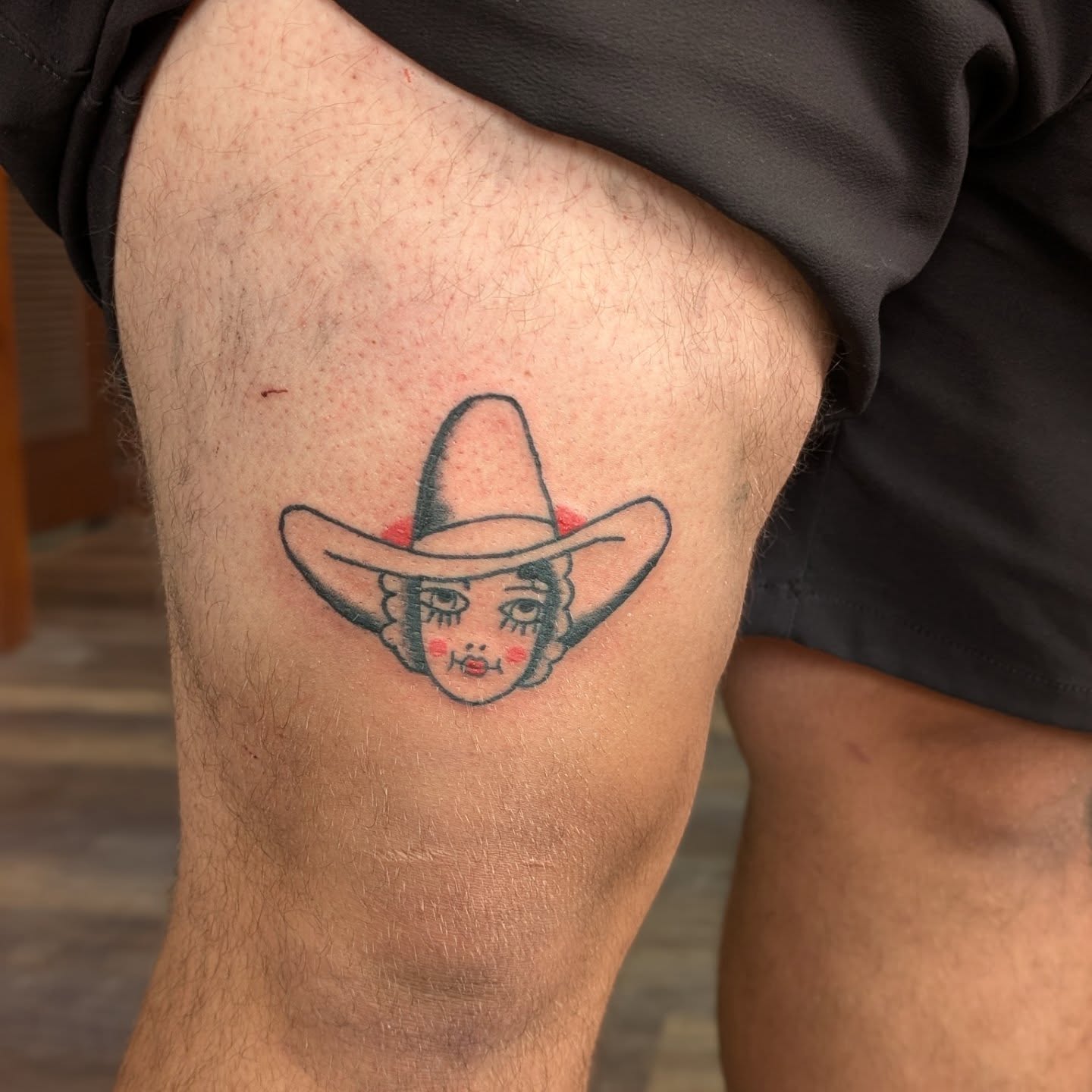 Sombrero-wearing woman anime tattoo on the thigh by Jon Sedor