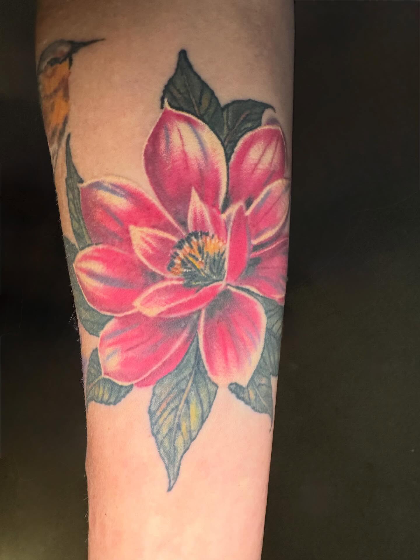 Flower realism tattoo on the forearm by spikecitytattoo