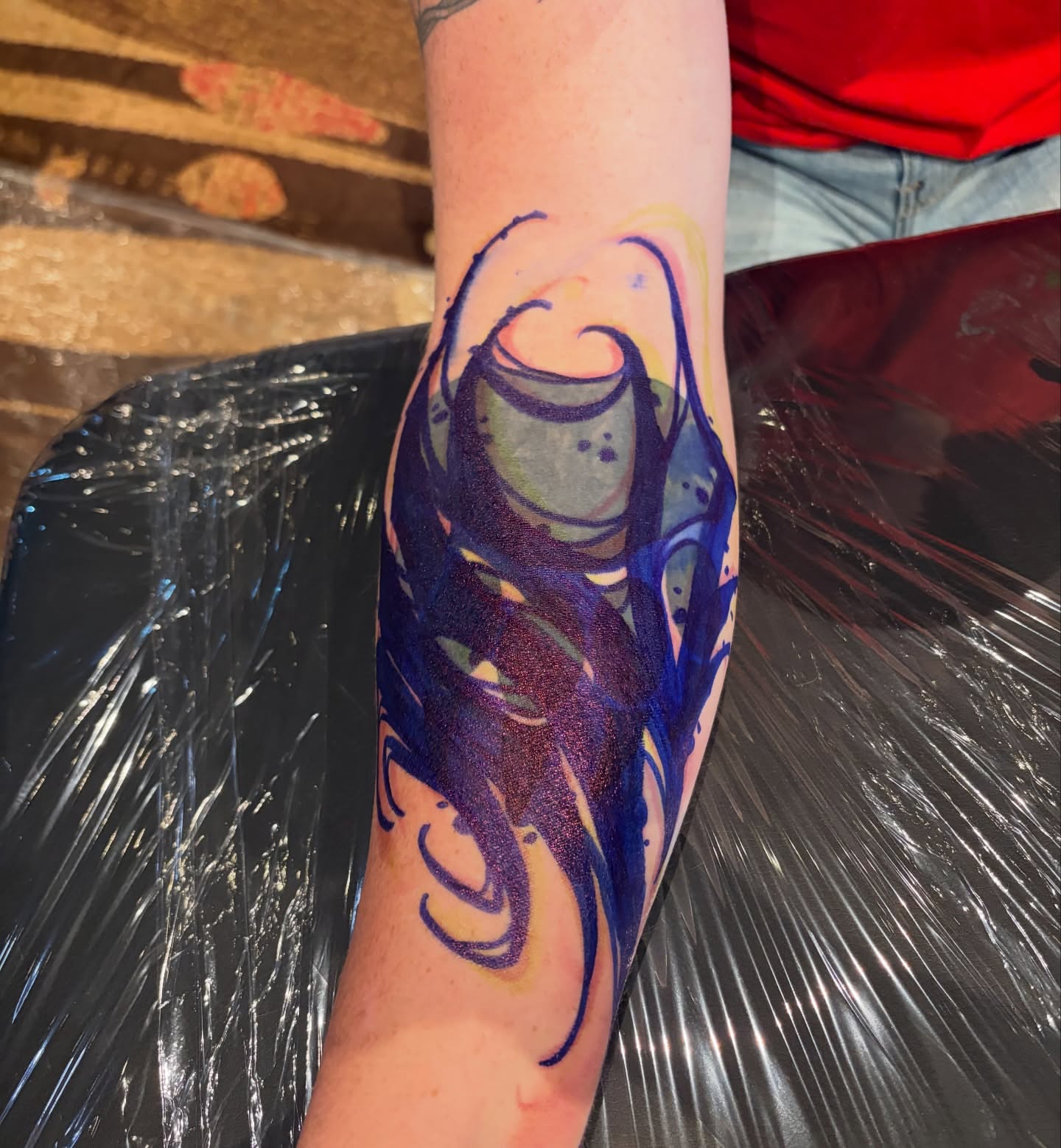 Abstract flame dotwork tattoo on the forearm by BodyArtByAlia