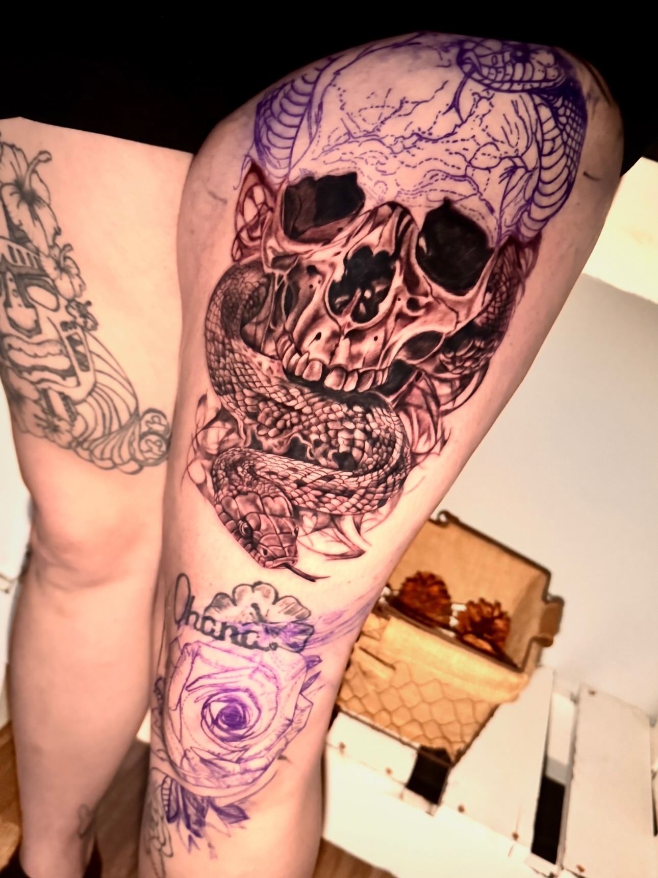 Skull and snake dark realism tattoo on the thigh by Tampa tattoo artist
