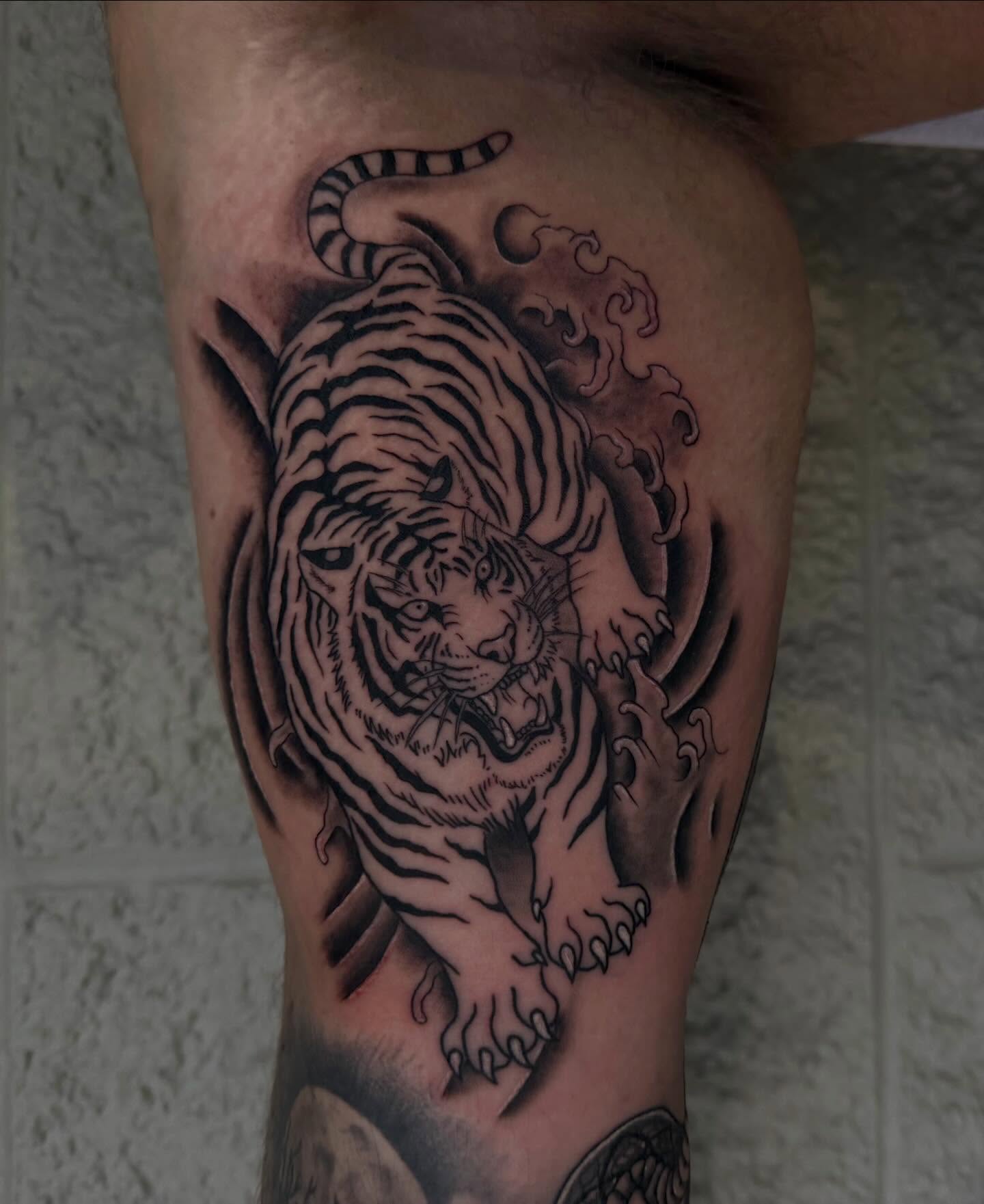 Tiger realism tattoo on the thigh by Kylee langford 🧿