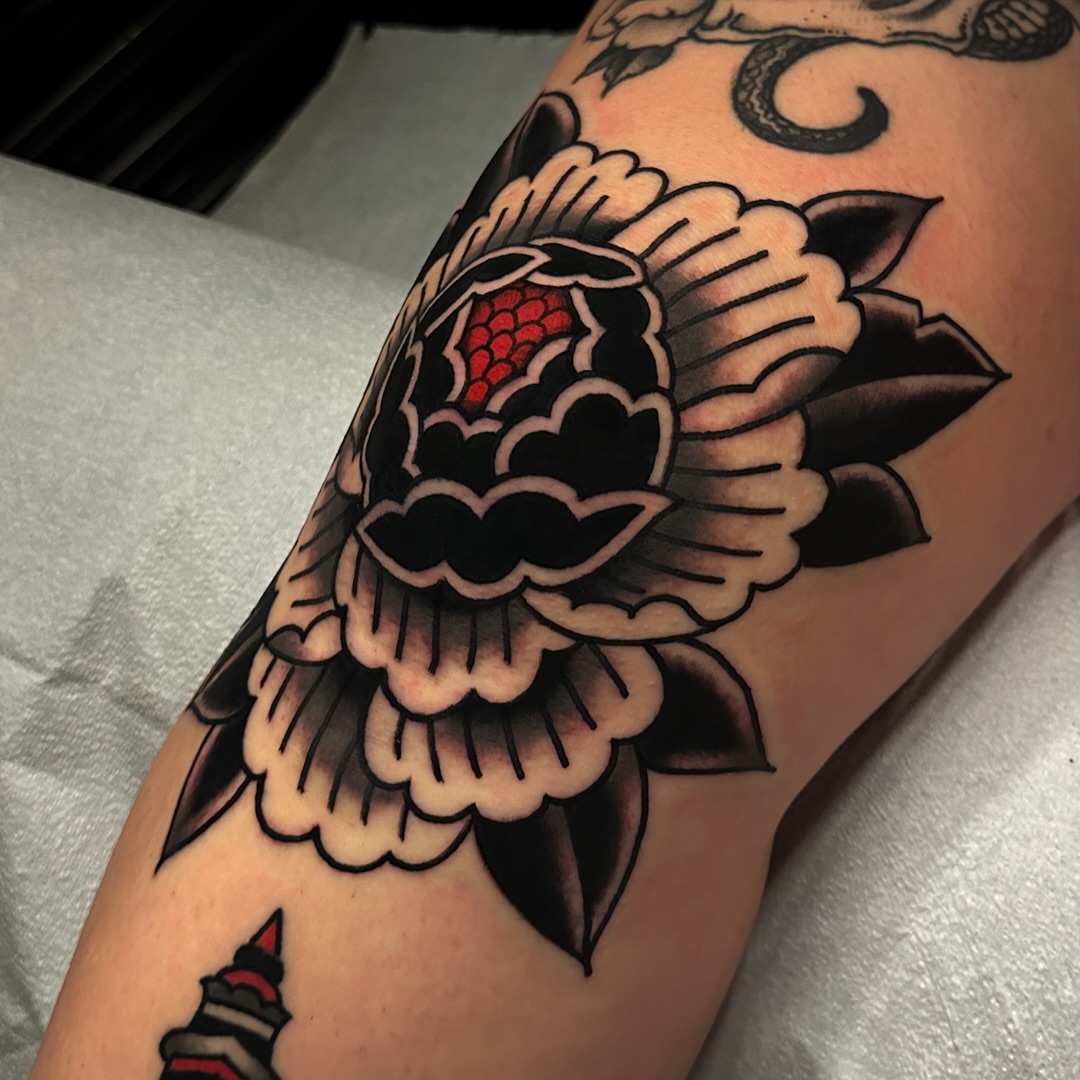 Flower American traditional tattoo on the forearm by Tony Perez- Austin Texas Tattooer