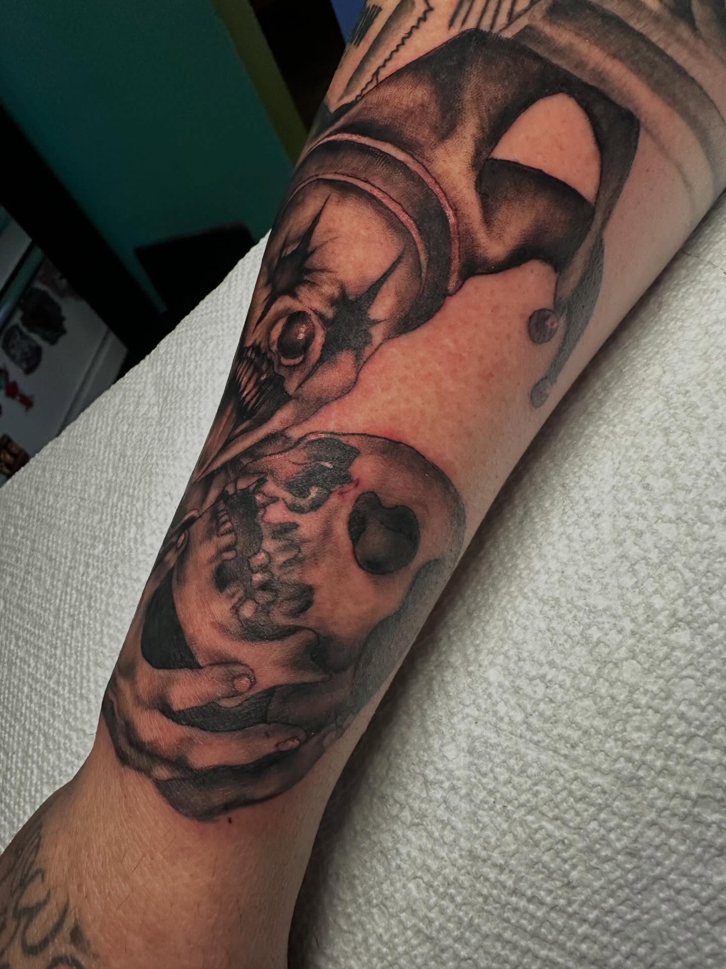 Skull and crossbones realism tattoo on the forearm by Elisha B🦷