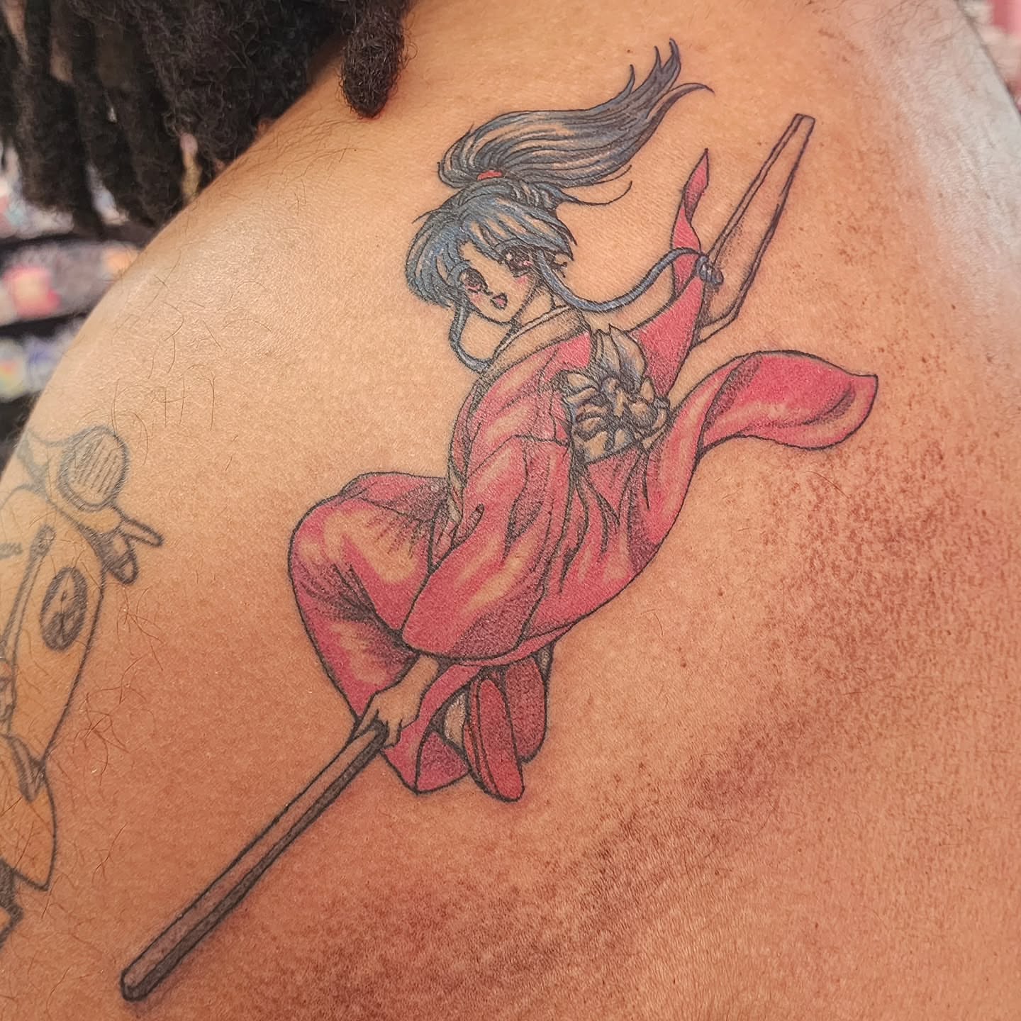 Anime character anime tattoo on the shoulder by K.F. Golden