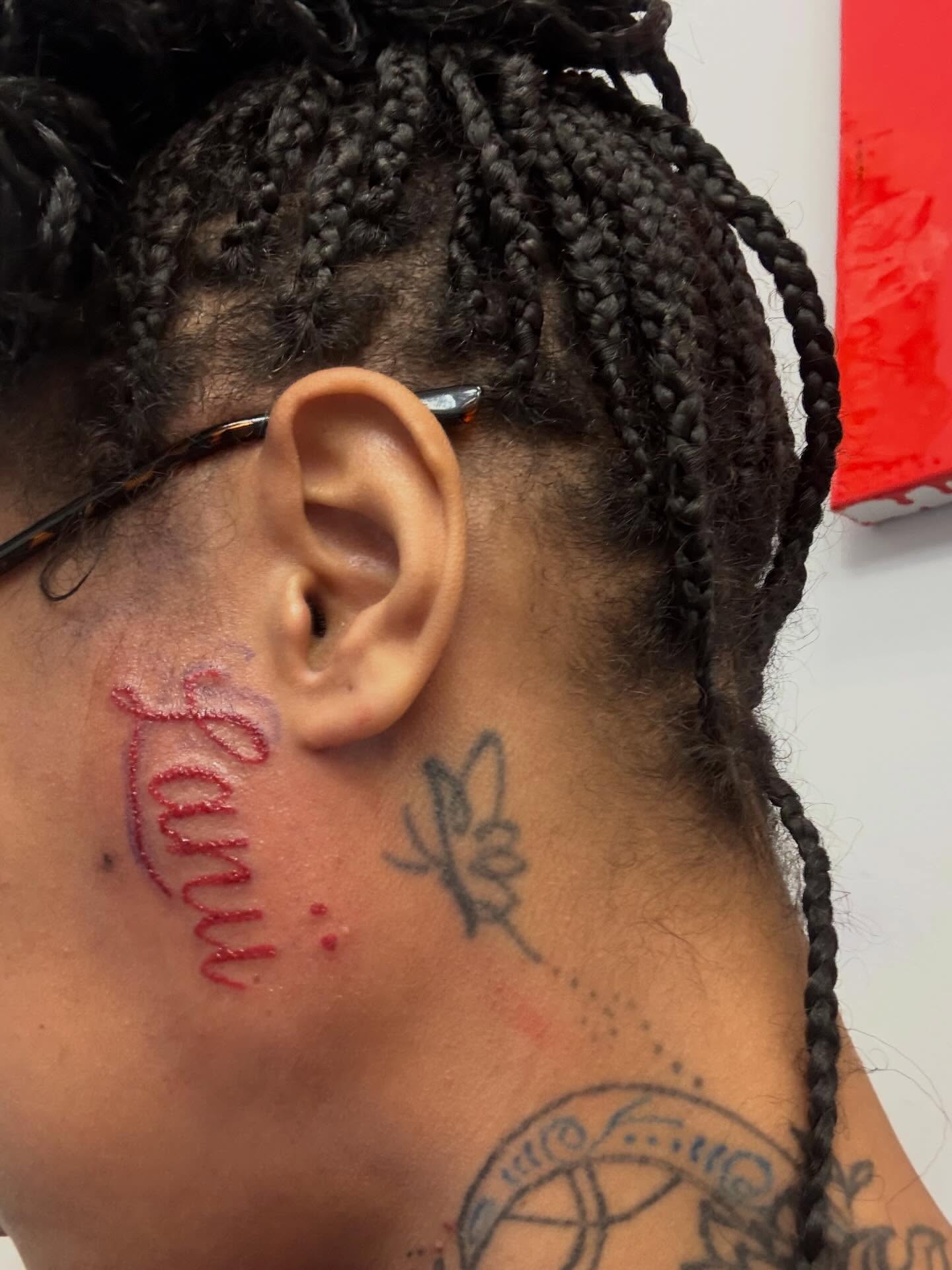 Name lettering script tattoo on the neck by Shine Jefferson, Memphis, Tennessee