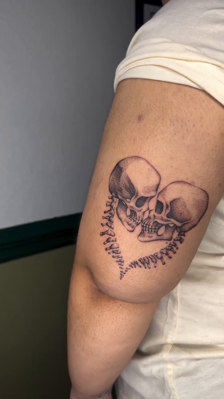 Two skulls kissing realism tattoo by Ash F