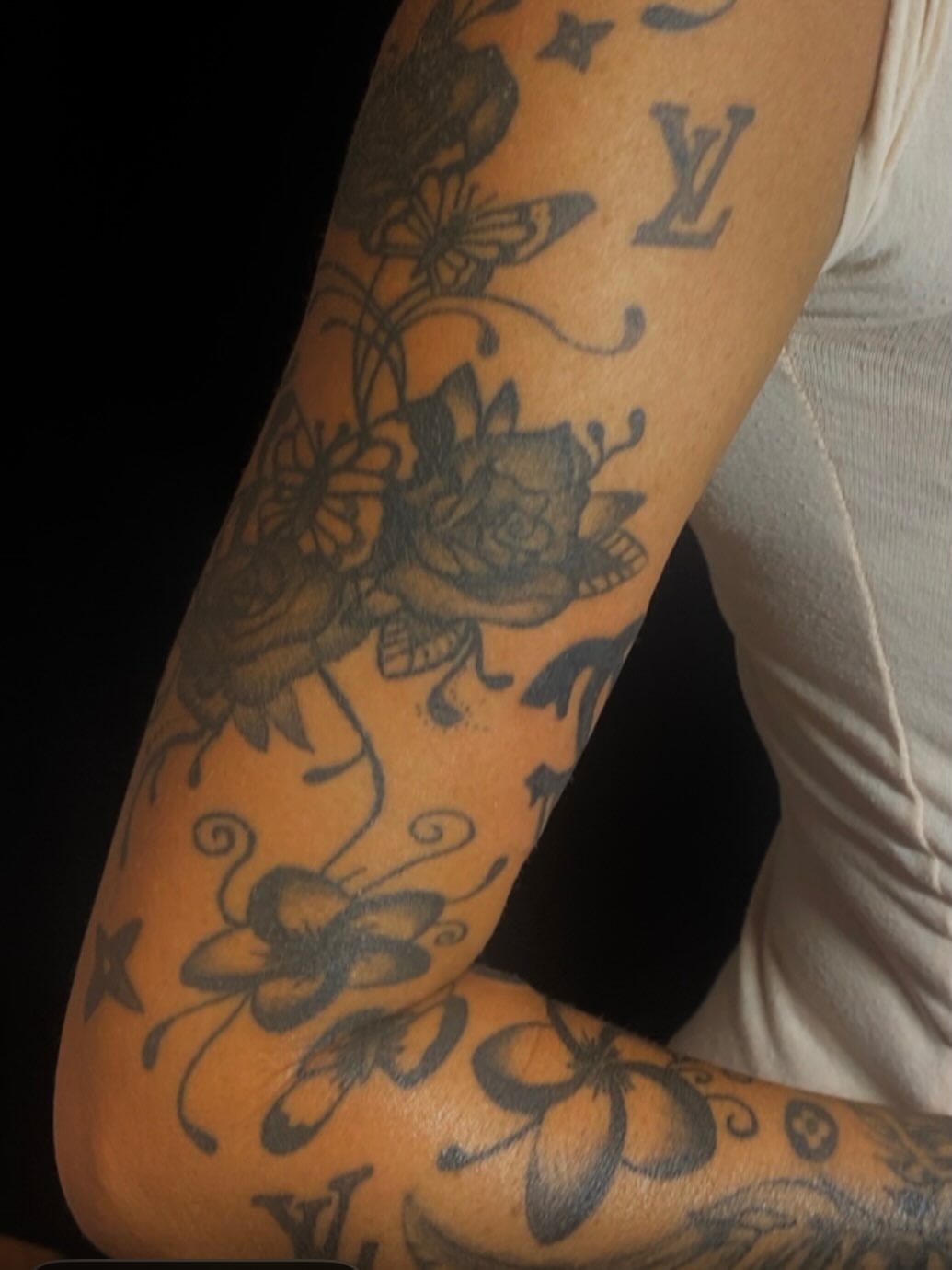 Floral and butterfly black and grey tattoo on the forearm by 𝒯𝒶𝓉𝓈𝑜𝓊𝓁 𝒷𝓎 C𝓁𝒶𝓊𝒹𝒾𝒶