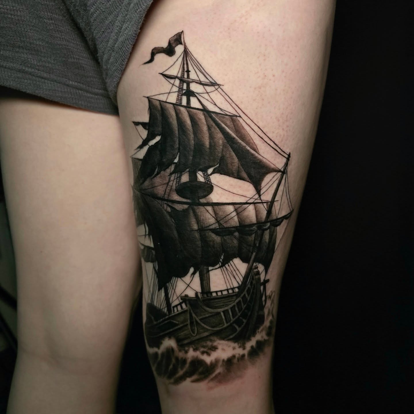 Ship black and grey tattoo on the forearm by Gabrielle Nicole Soucie