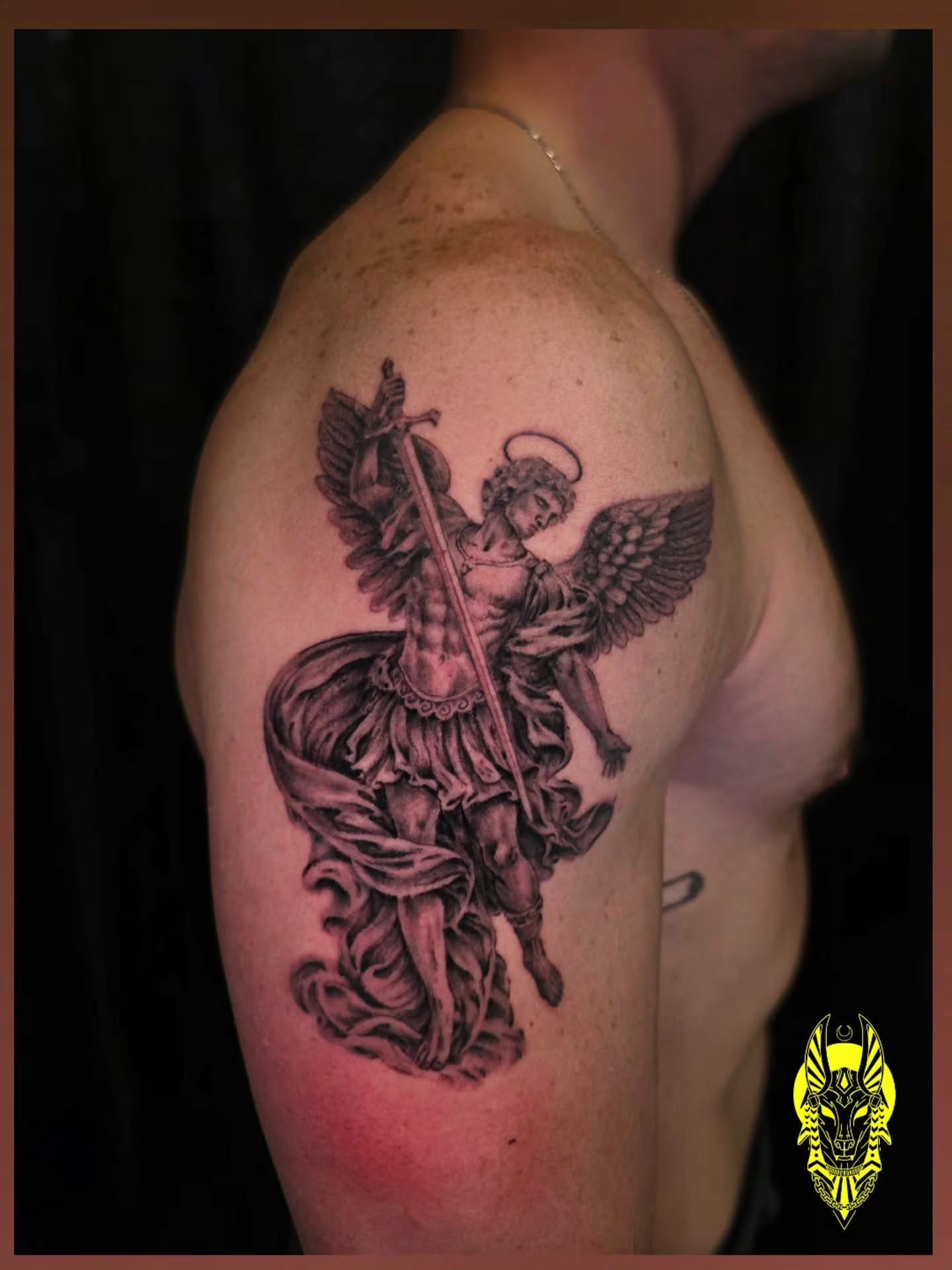 Angel with sword black and grey tattoo on the shoulder by Bry True