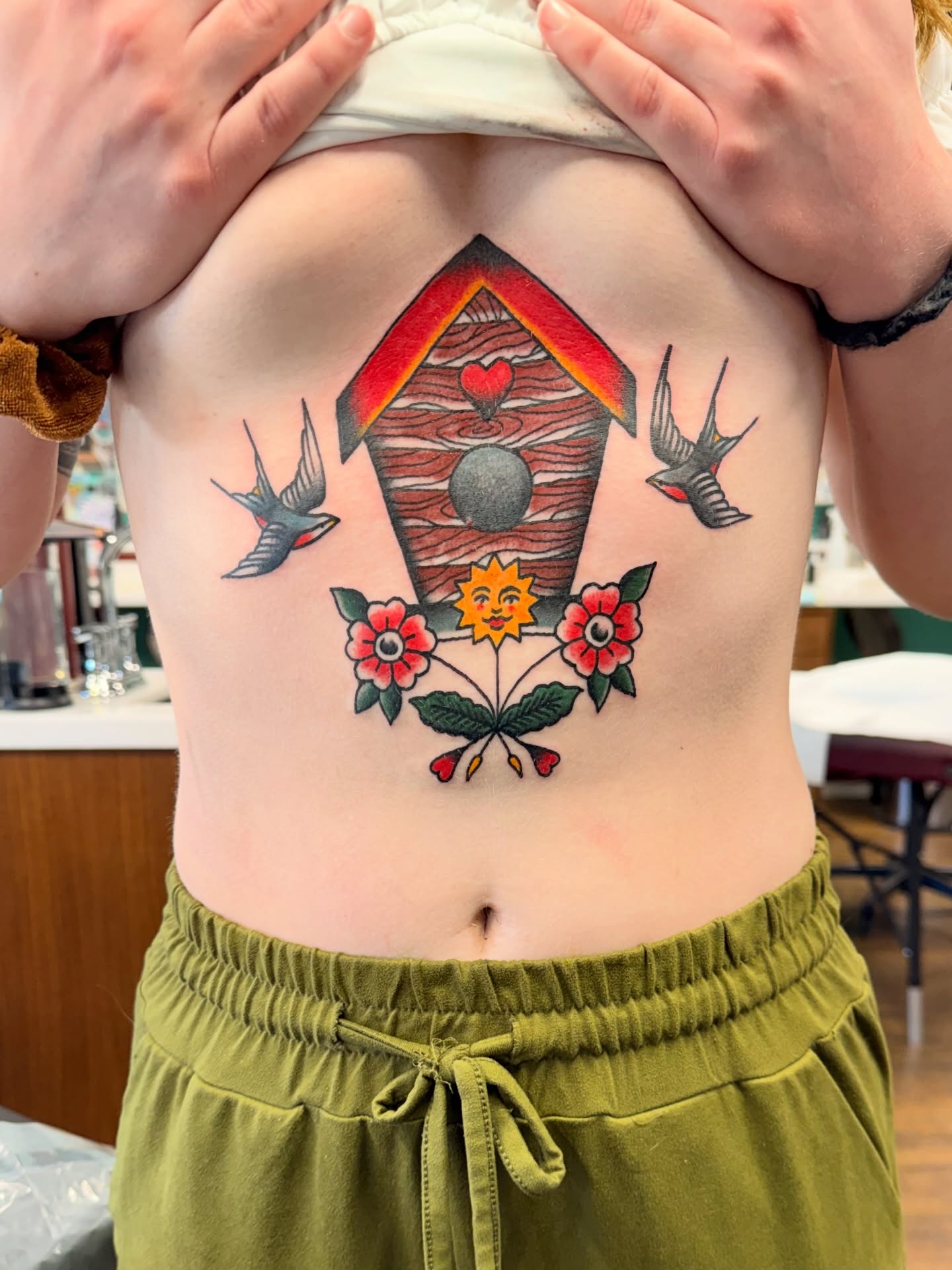 Birdhouse and flowers American traditional tattoo on the torso by Aaron ulfstam