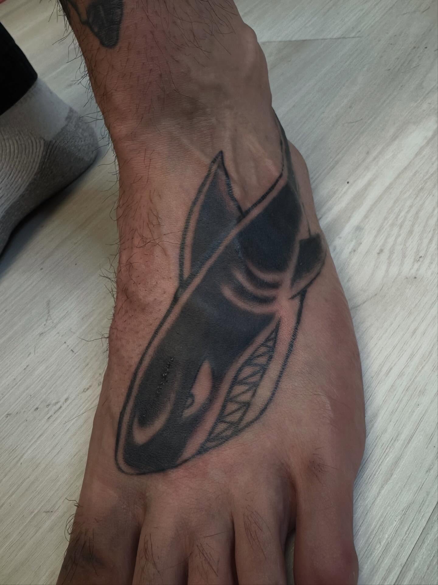 Shark black and grey tattoo on the foot by Gigi