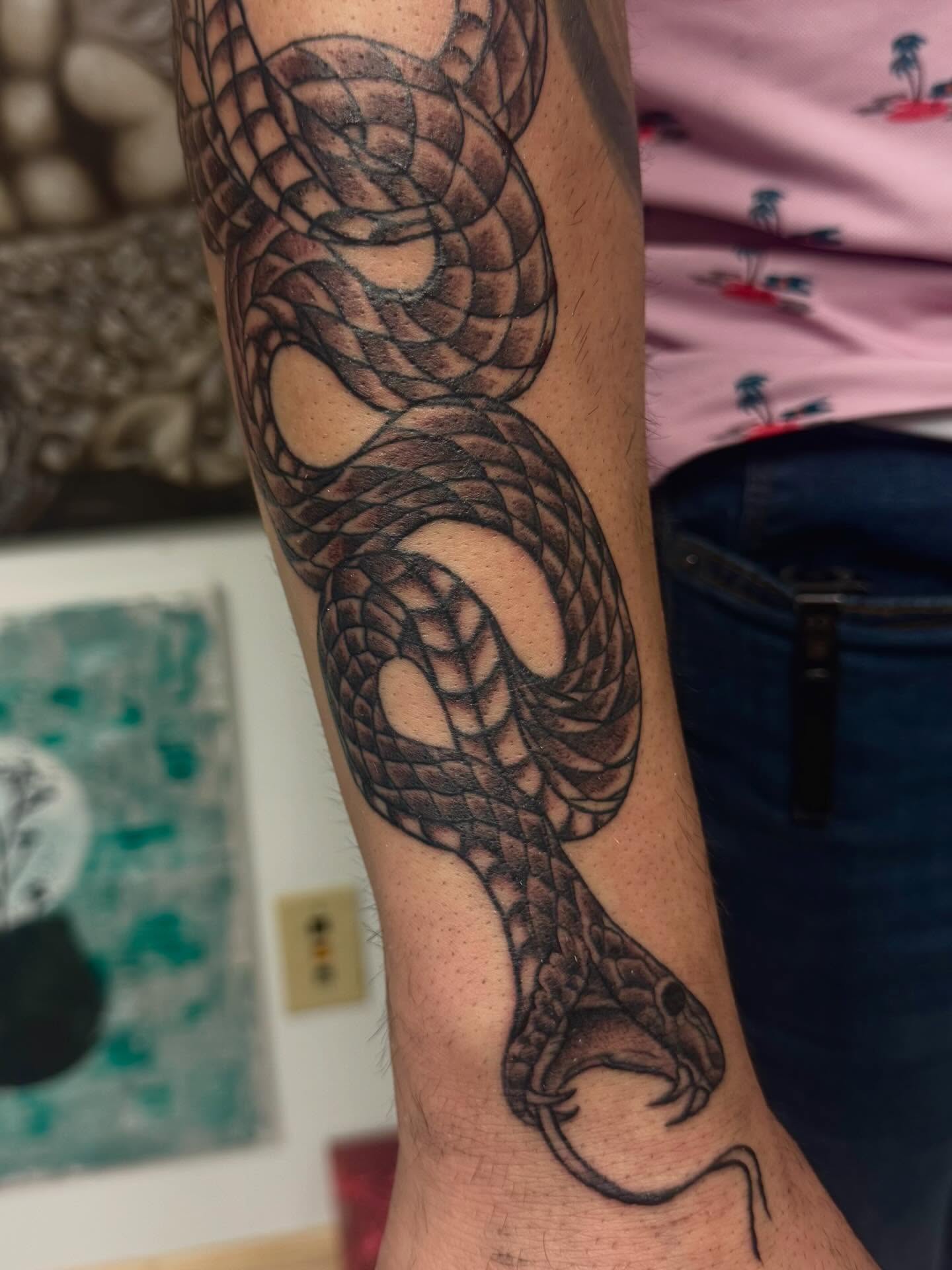 Snake black and grey tattoo on the forearm by Gigi
