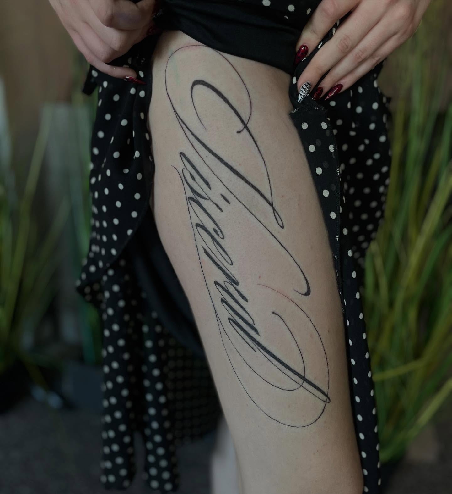 Script lettering lettering script tattoo on the thigh by Trinity