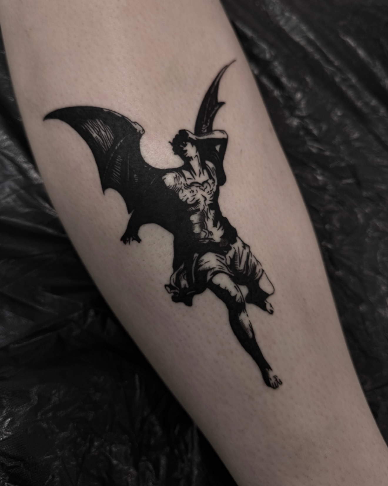 Winged angel black and grey tattoo on the forearm by Blackwork Vamos