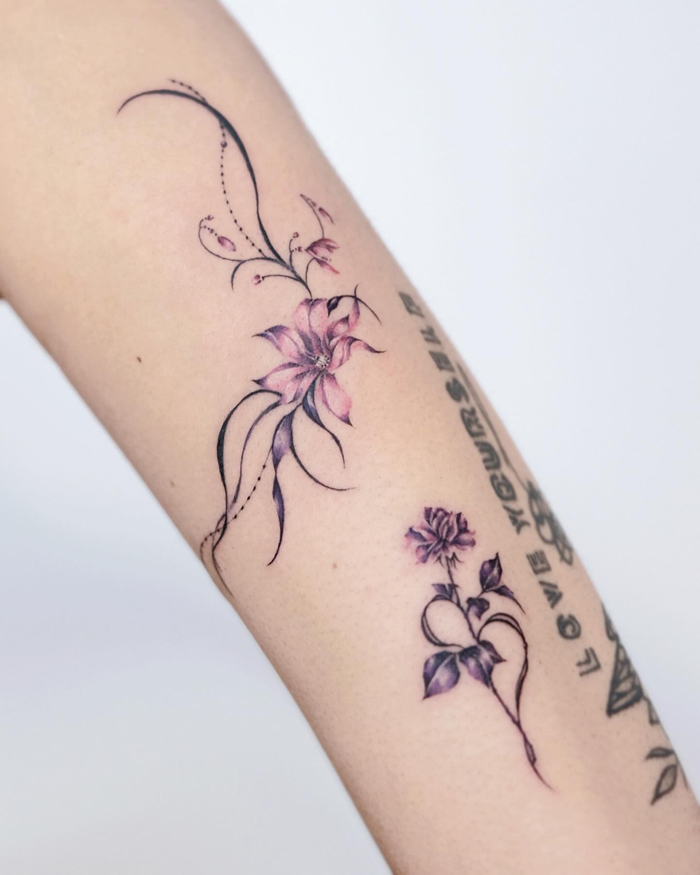 Floral design fine line tattoo on the forearm by 애박 ⋆⁺₊ ₊⁺⋆ Aebak