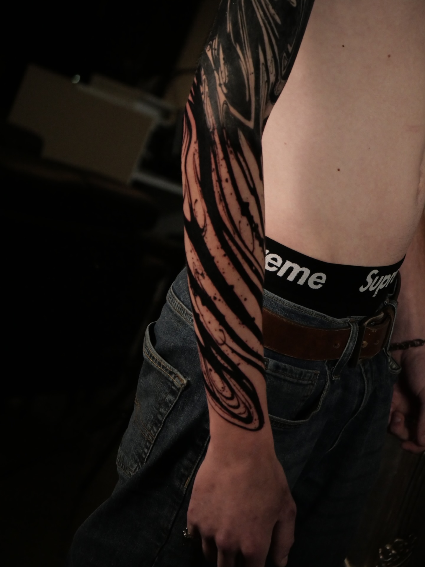Abstract pattern black and grey tattoo on the forearm by Sloppy