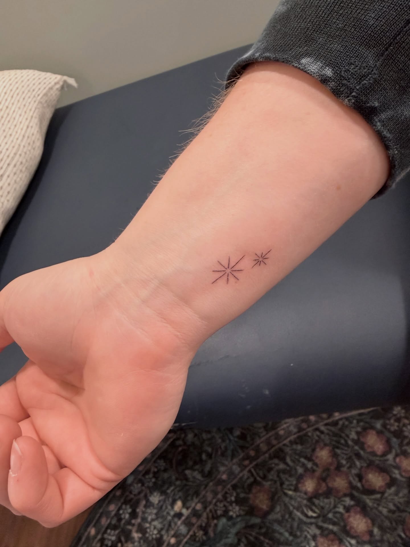 Geometric stars geometric tattoo on the forearm by Reverie Studio