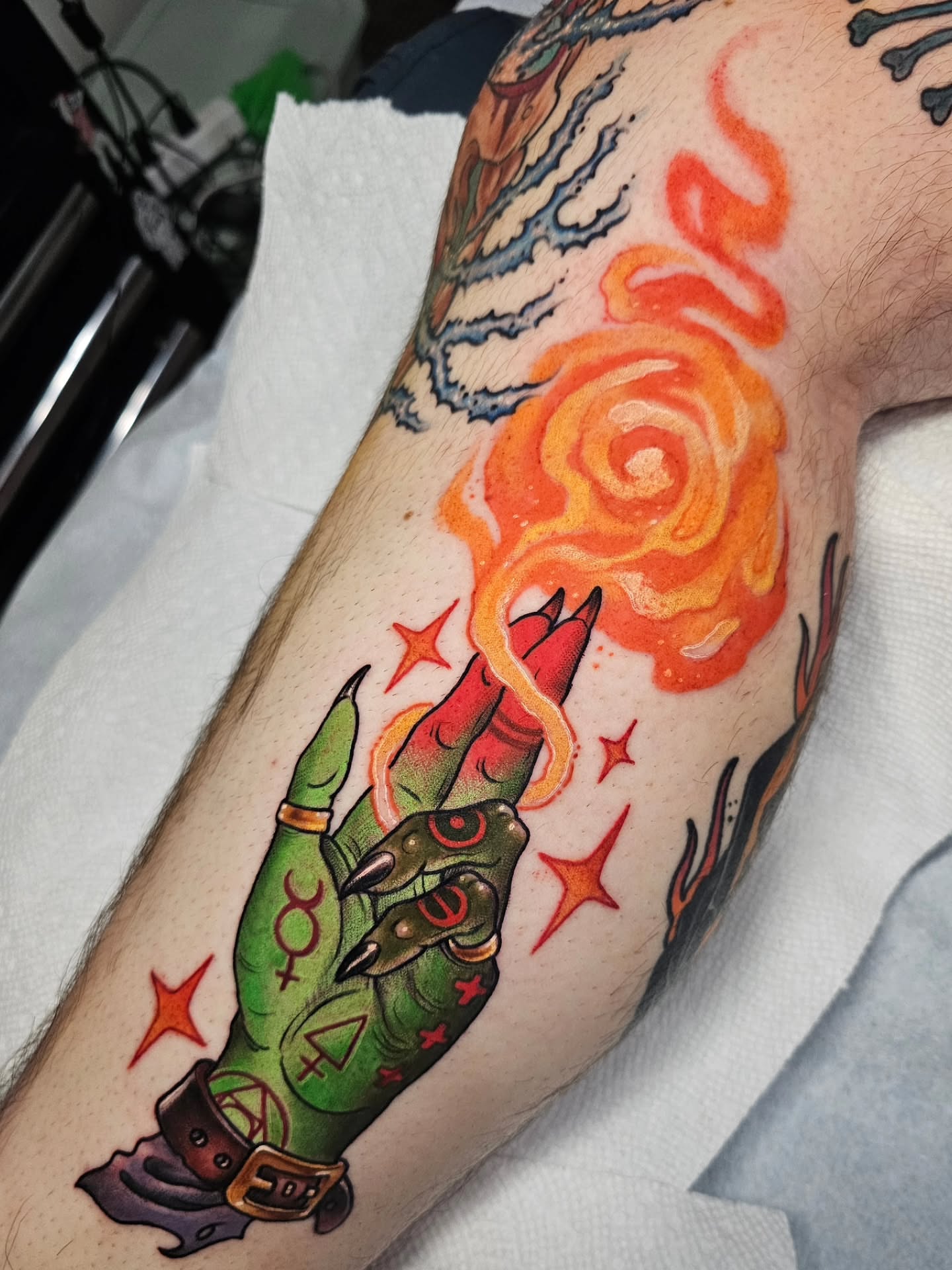 Flame and hand American traditional tattoo on the forearm by Shannon