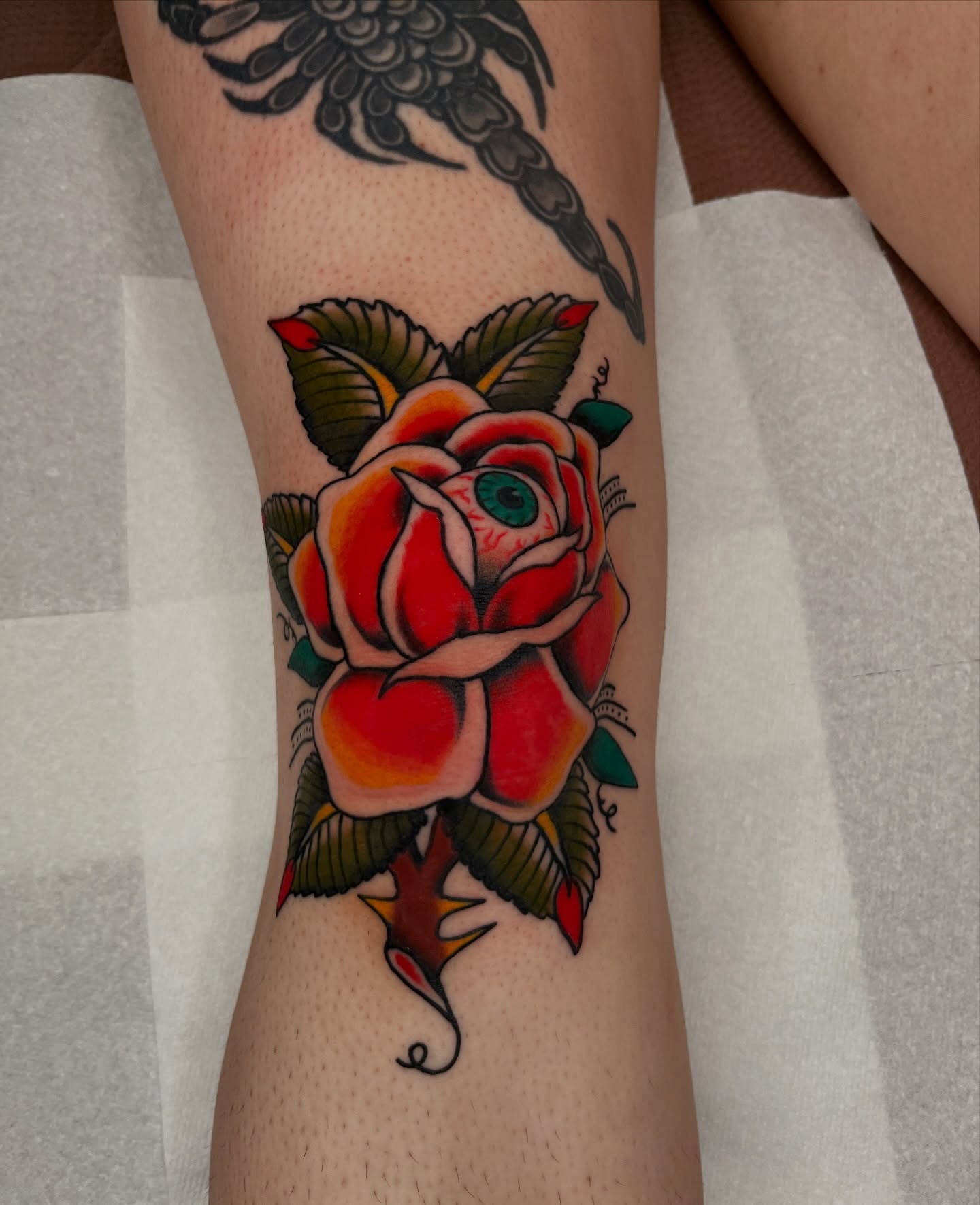 Rose American traditional tattoo on the forearm by Kehrmie Tattoos, Berkeley, California