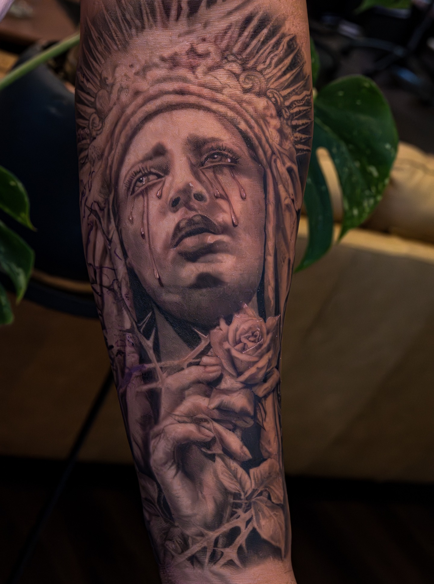 Woman with roses realism tattoo on the forearm by Simon Pouliot