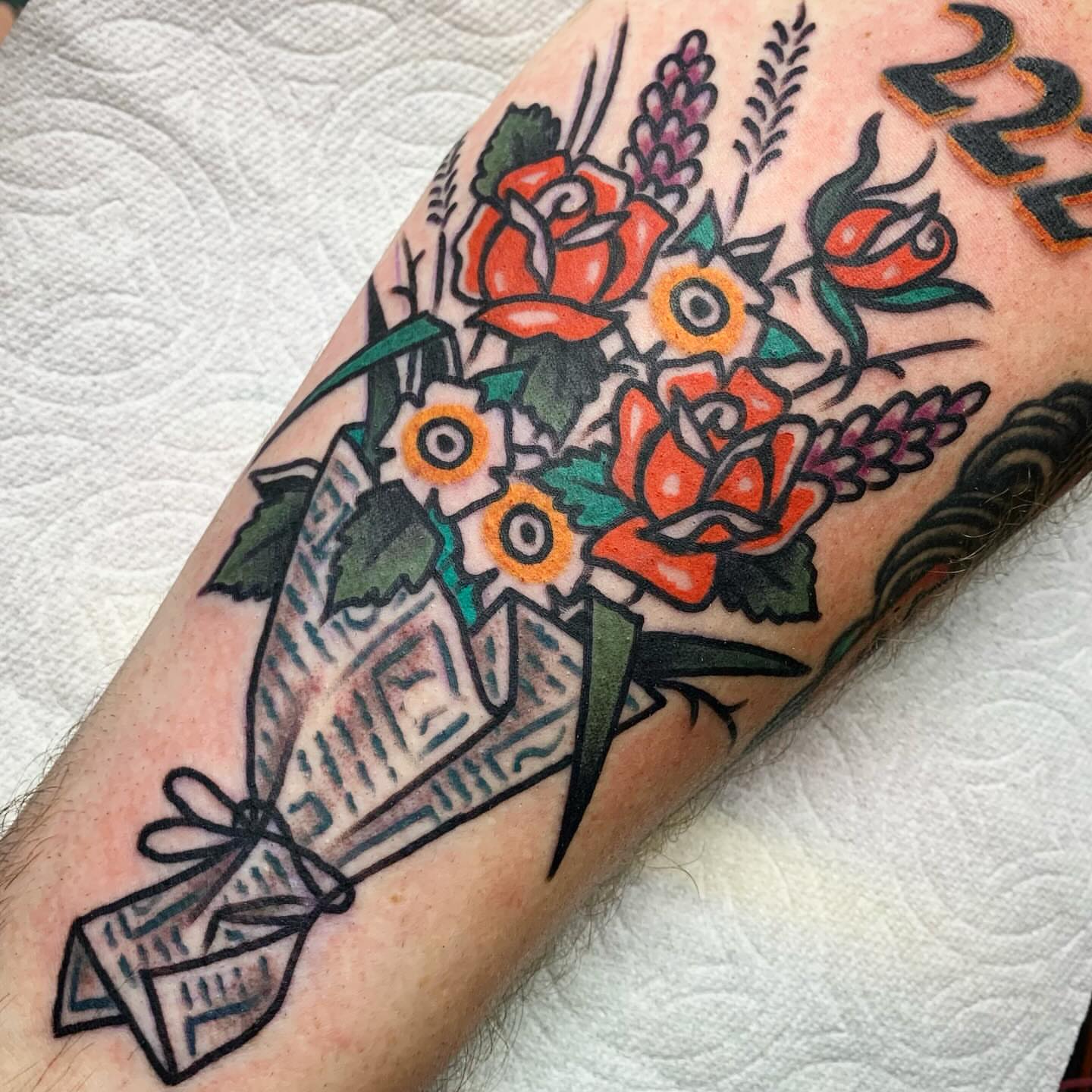 Flower bouquet American traditional tattoo on the forearm by Los Angeles Tattoo Artist