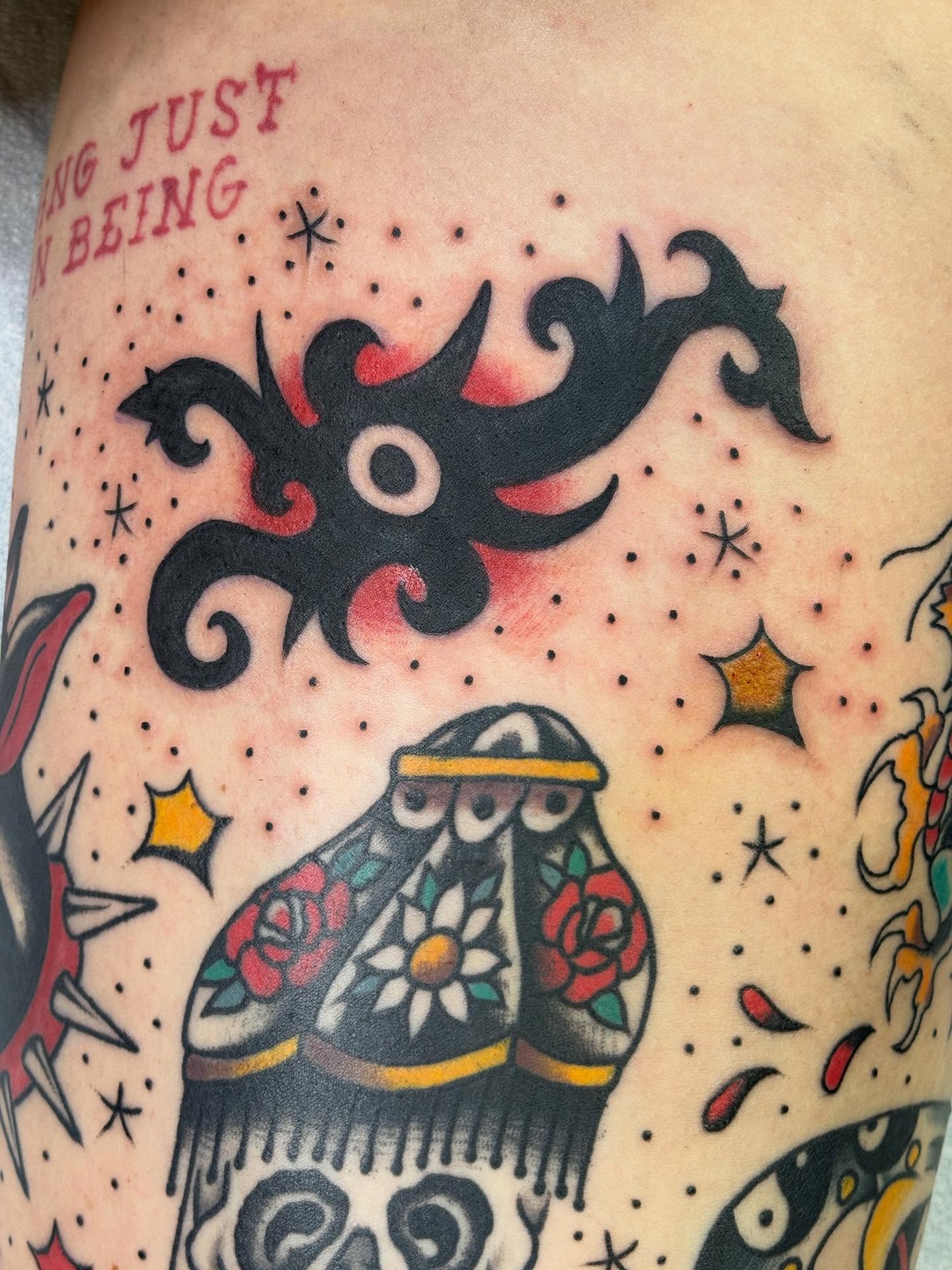 Sugar skull American traditional tattoo on the thigh by Mike DiCicco