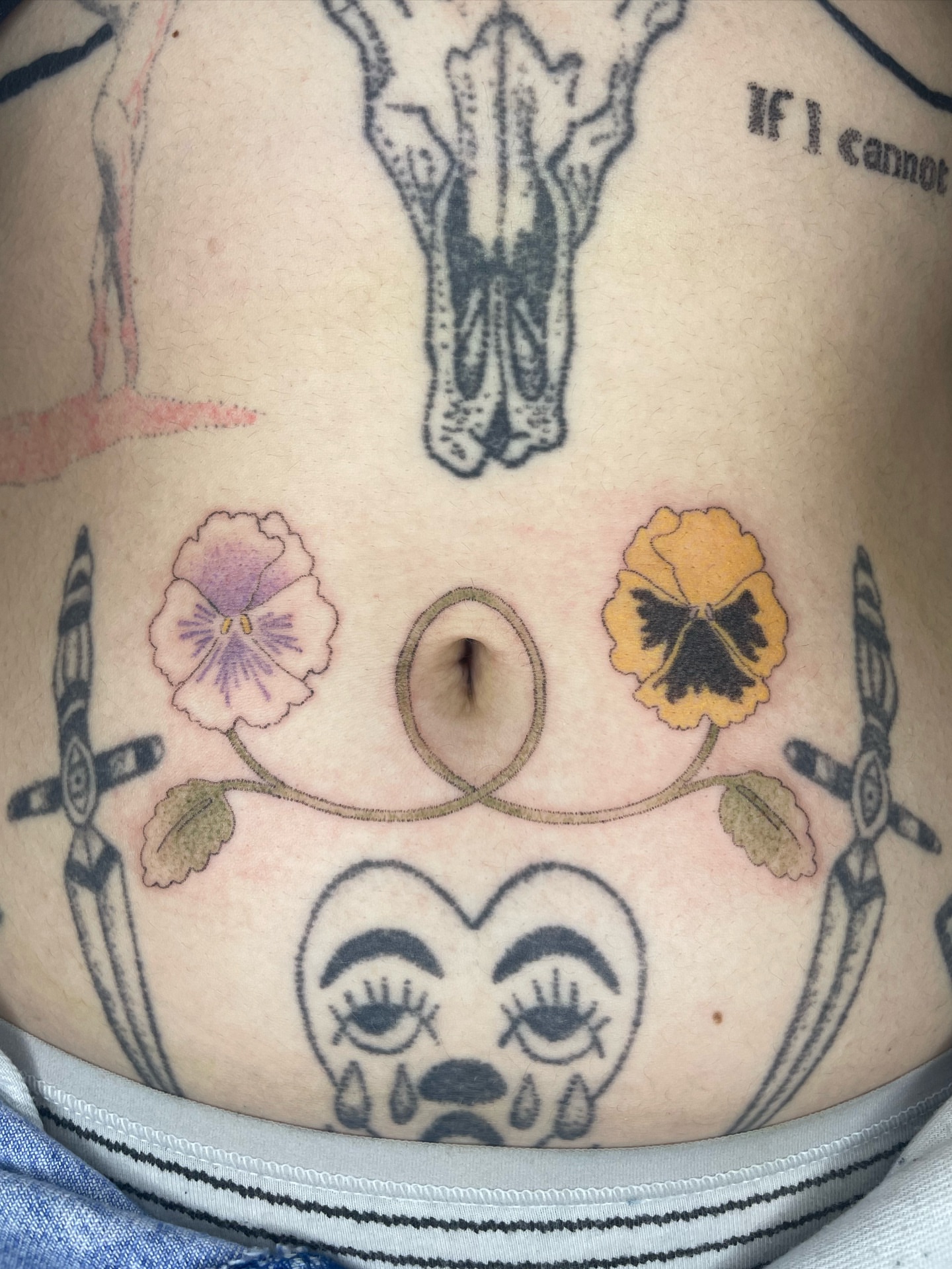 Crying face with flowers neo-traditional tattoo by cait