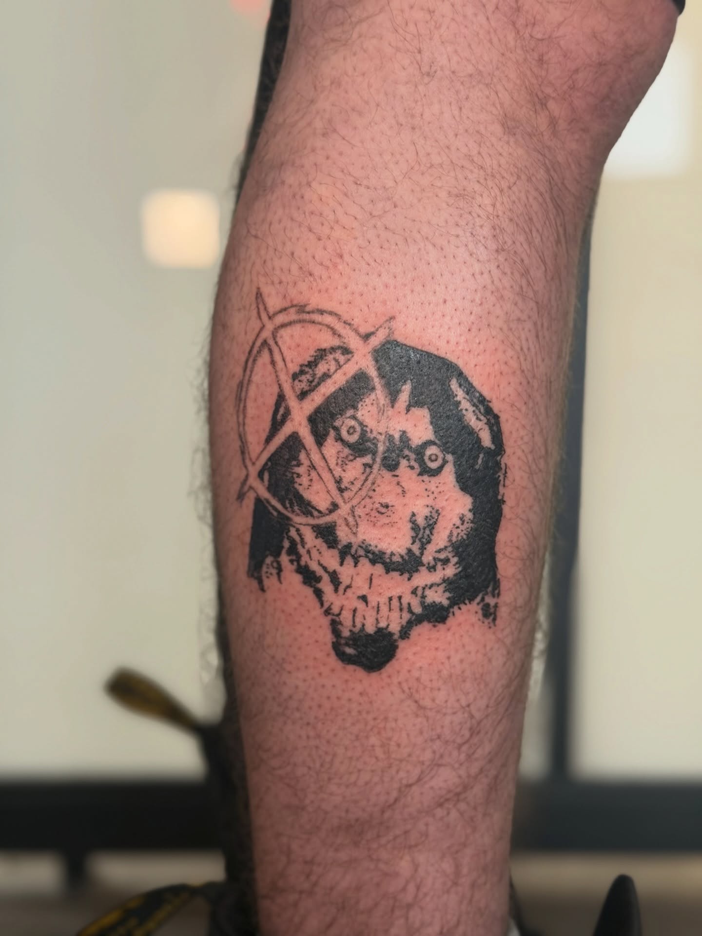 Skull with anarchy symbol black and grey tattoo on the forearm by Alaska