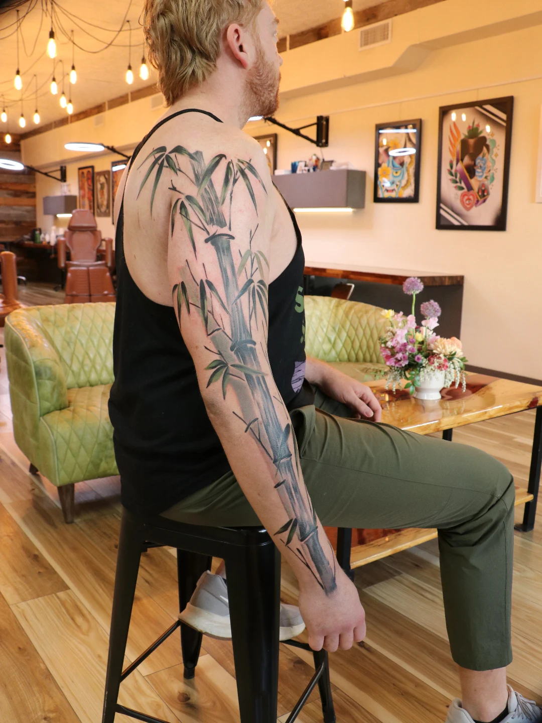Bamboo realism tattoo on the upper arm by Jhenn