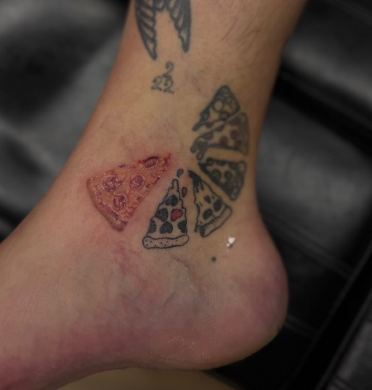 Pizza slices American traditional tattoo on the foot by Boise Tattoo Artist
