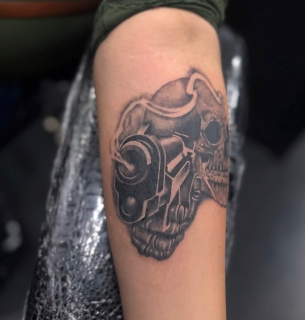 Mechanical skull realism tattoo on the forearm by Boise Tattoo Artist